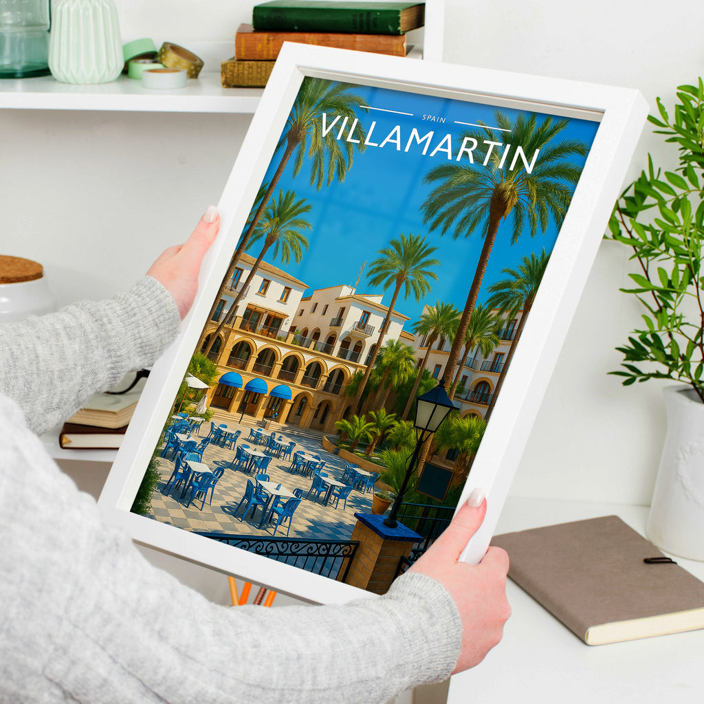 Villamartin Travel Poster in a white frame, held to show scale