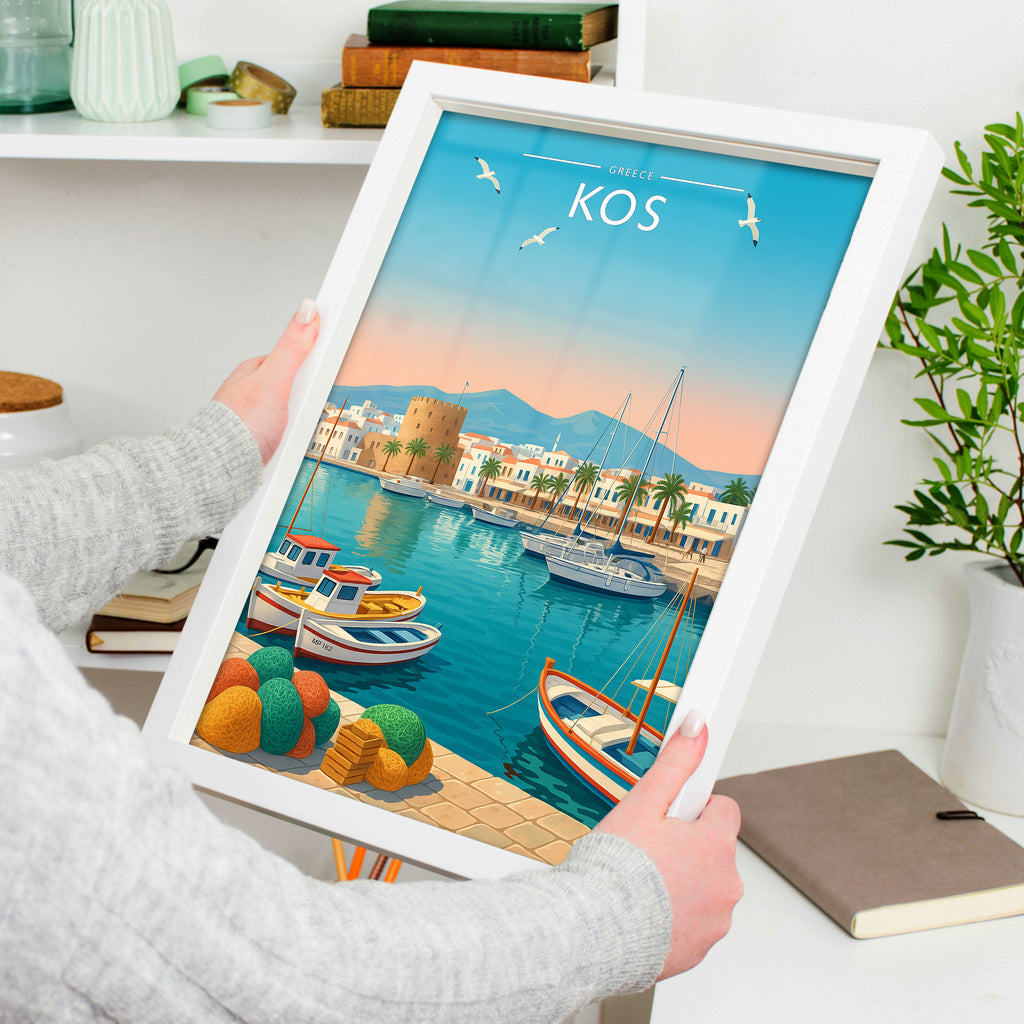 Kos #2 Travel Poster in a white frame, held to show scale