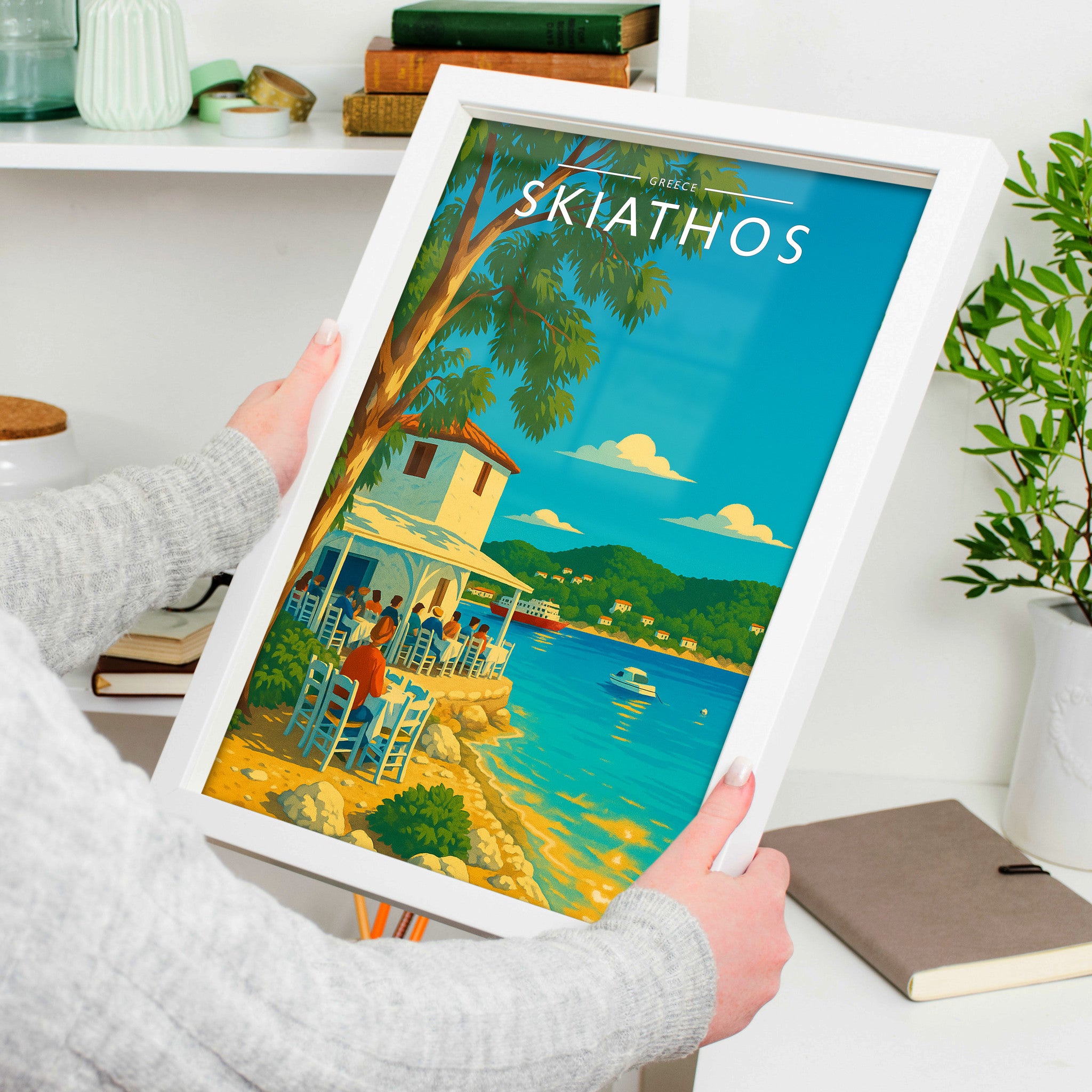 Skiathos #2 Travel Poster in a white frame, held to show scale