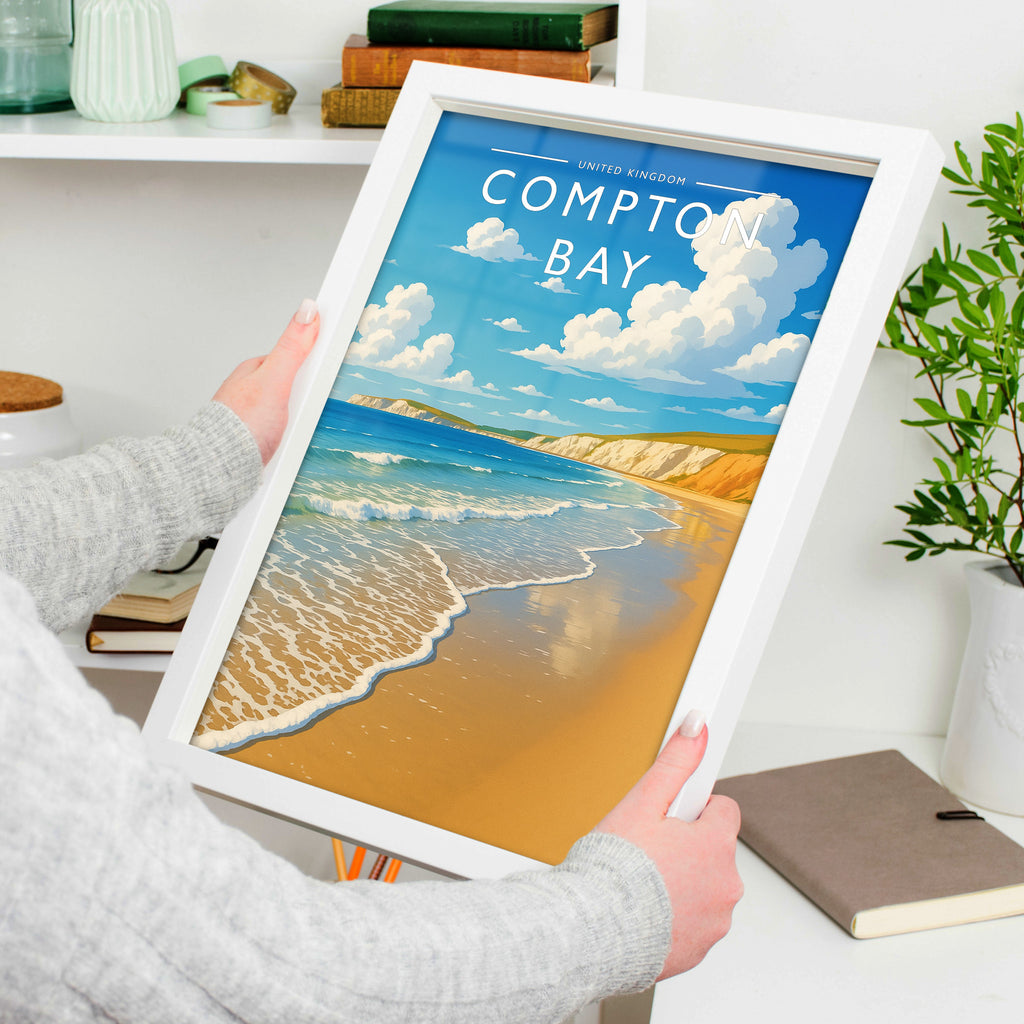 Compton Bay Travel Poster in a white frame, held to show scale