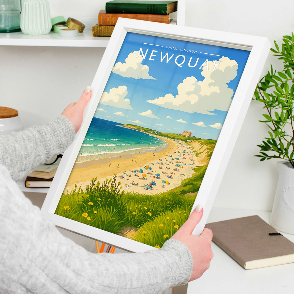 Newquay Travel Poster in a white frame, held to show scale