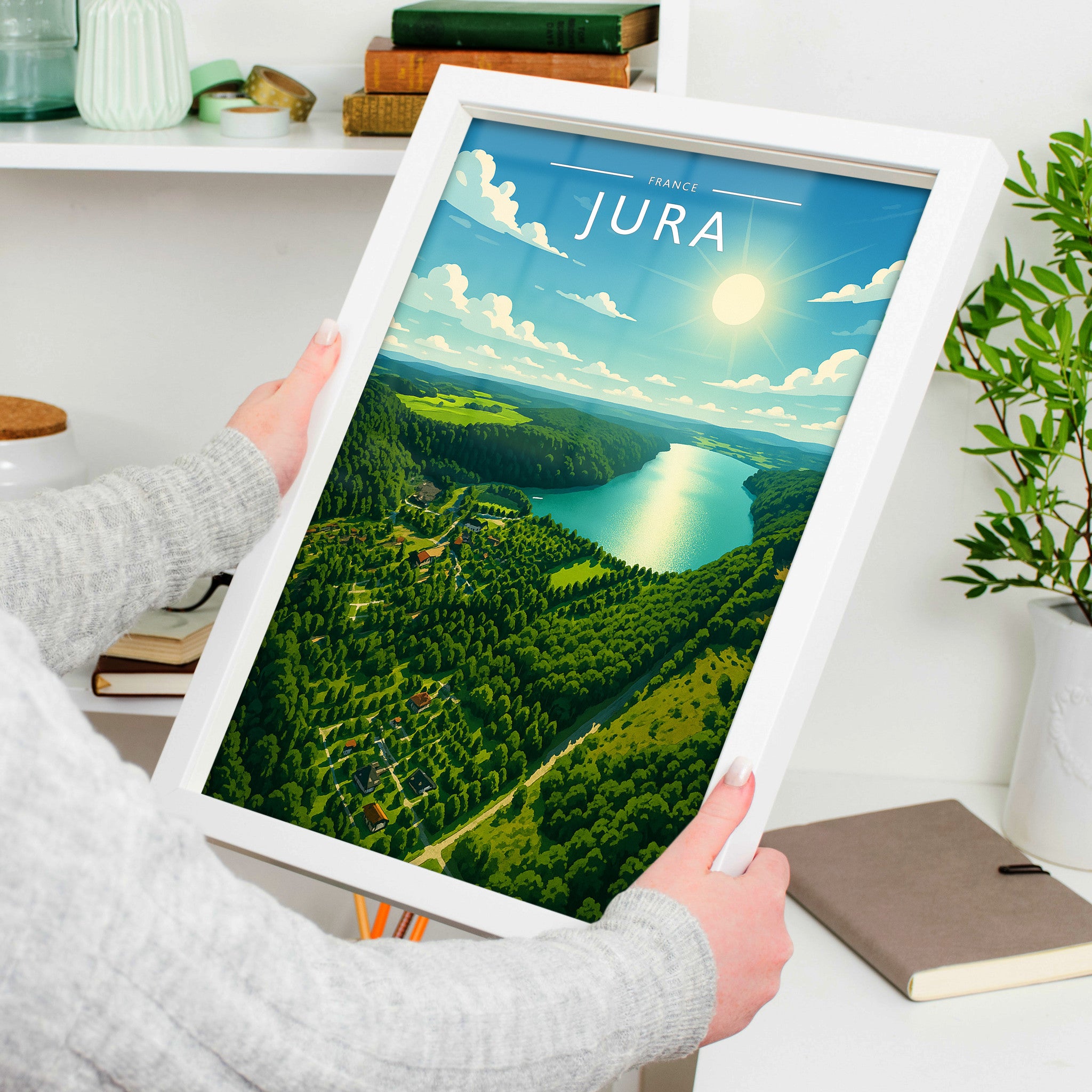 Jura Travel Poster in a white frame, held to show scale