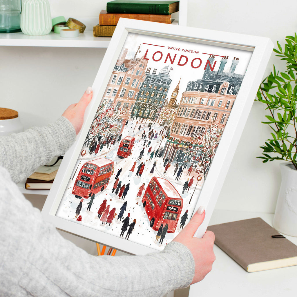 London #2 Travel Poster in a white frame, held to show scale