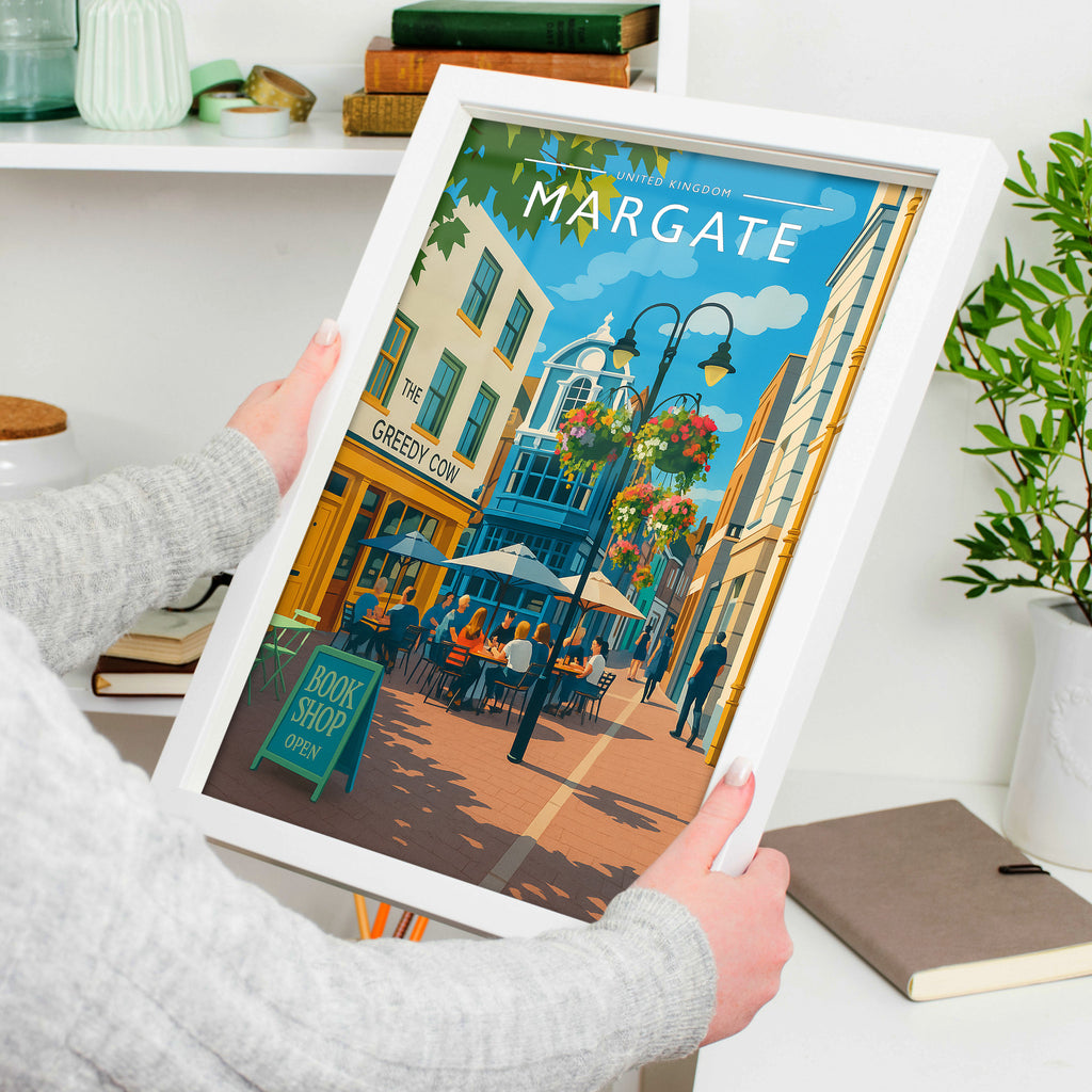 Margate #2 Travel Poster in a white frame, held to show scale