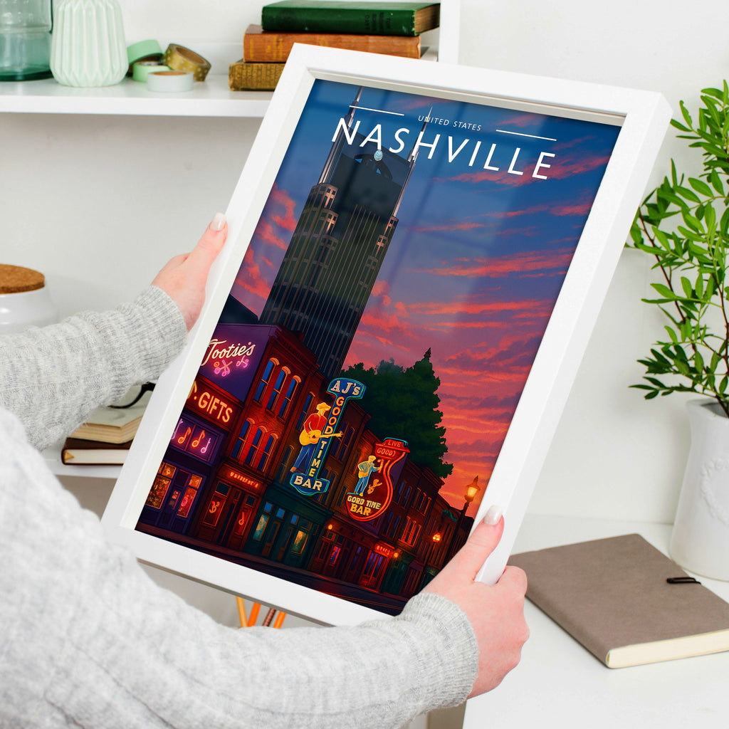 Nashville Travel Poster in a white frame, held to show scale