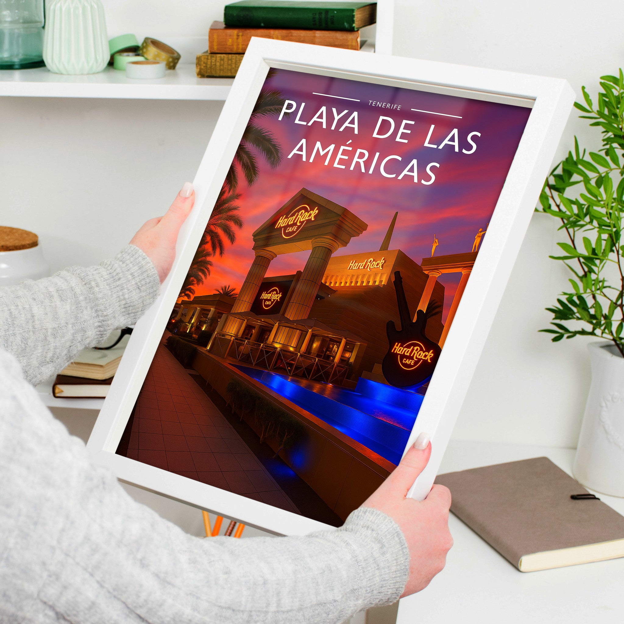 Playa de las Américas Travel Poster in a white frame, held to show scale