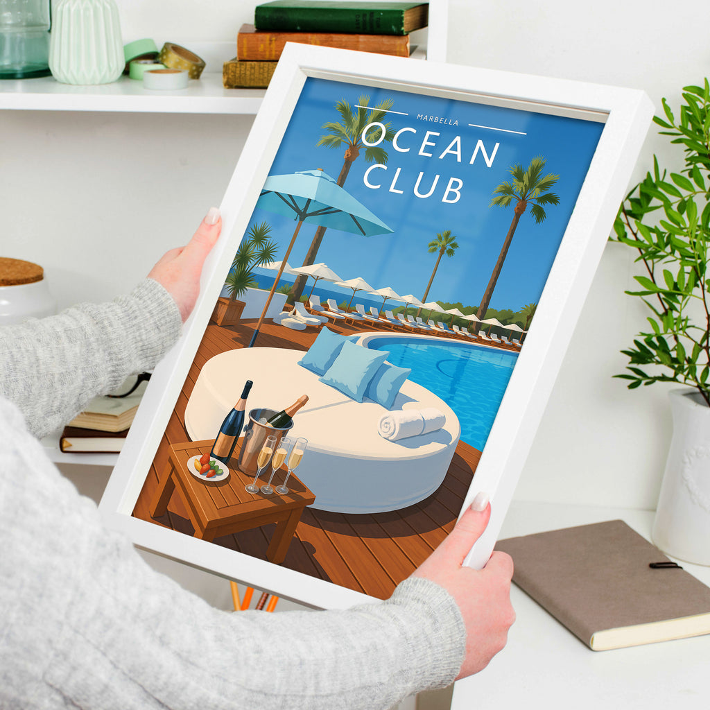 Marbella #2 Travel Poster in a white frame, held to show scale