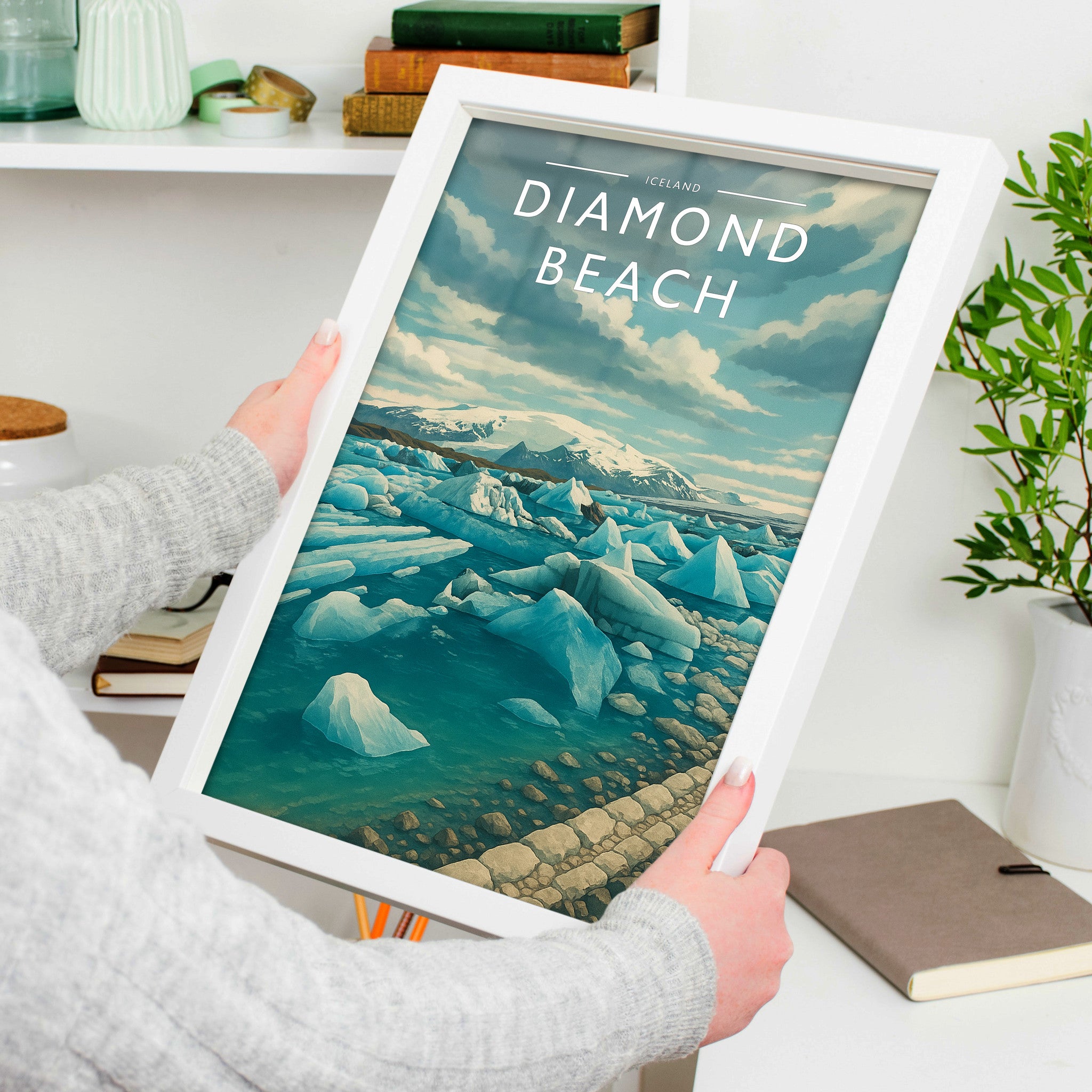 Diamond Beach Travel Poster in a white frame, held to show scale