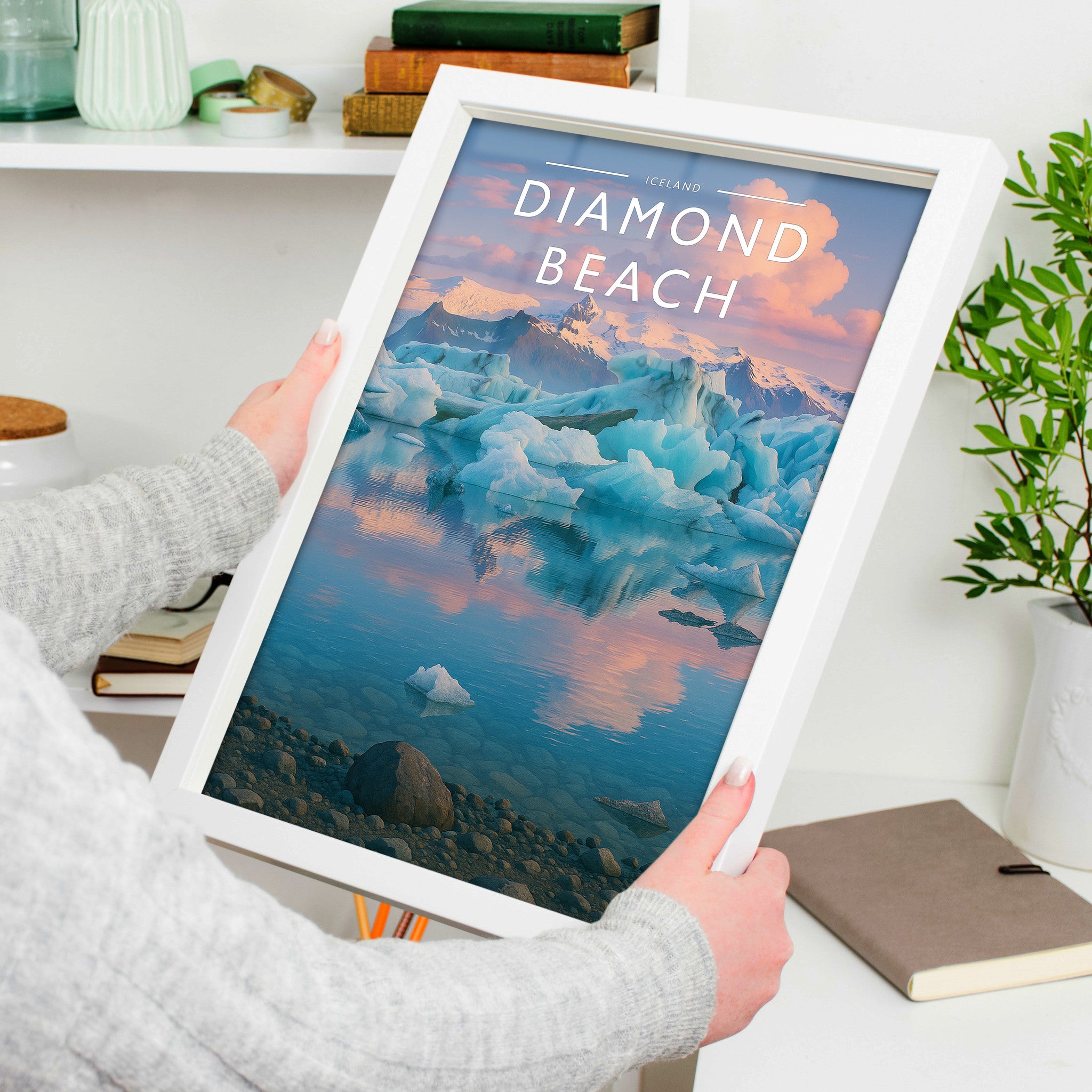 Diamond Beach #2 Travel Poster in a white frame, held to show scale