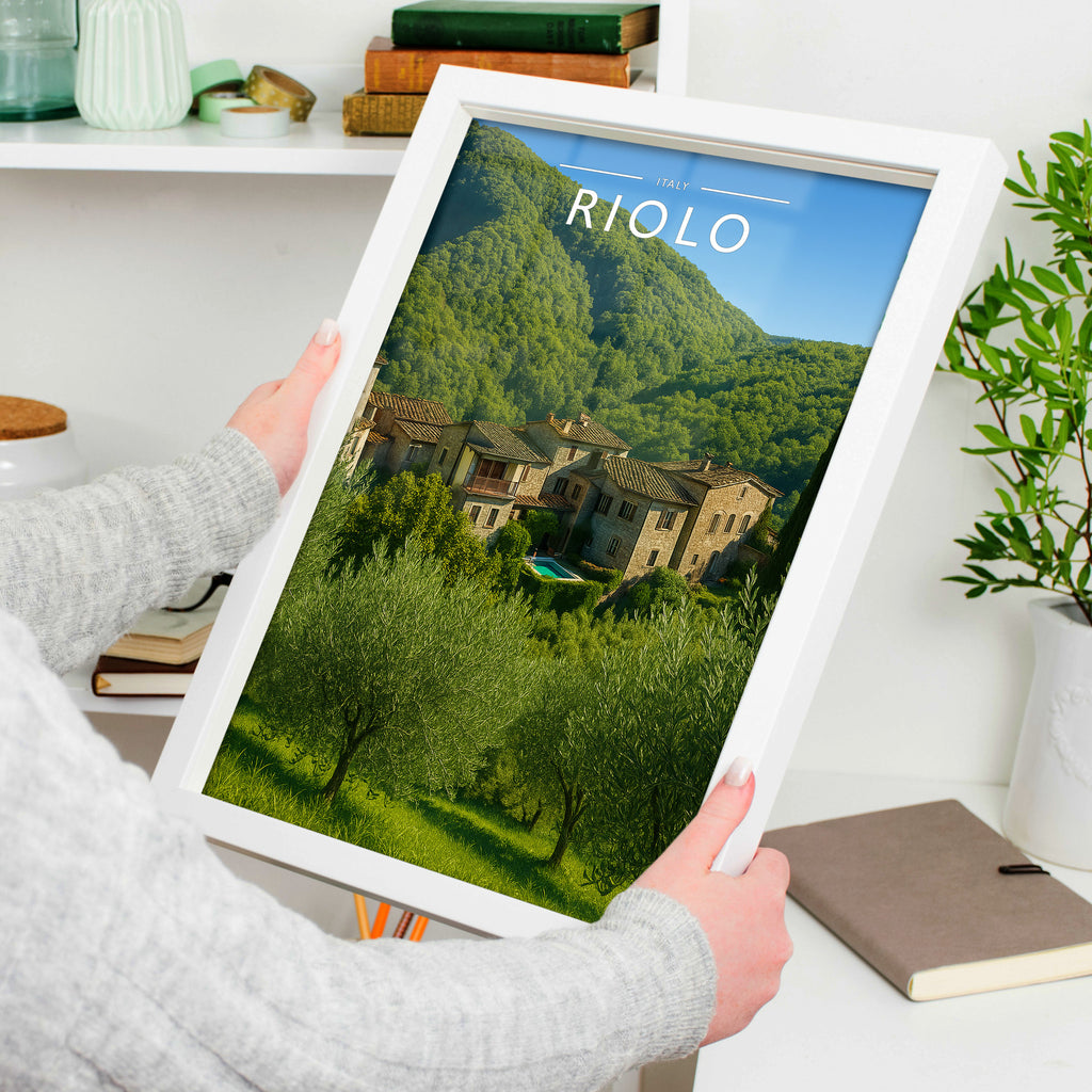 Riolo Travel Poster in a white frame, held to show scale