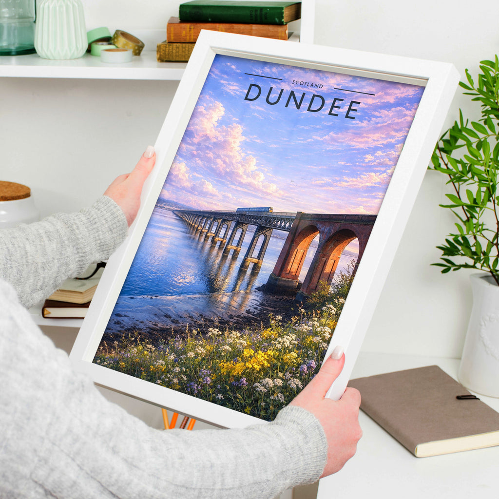 Dundee Travel Poster in a white frame, held to show scale