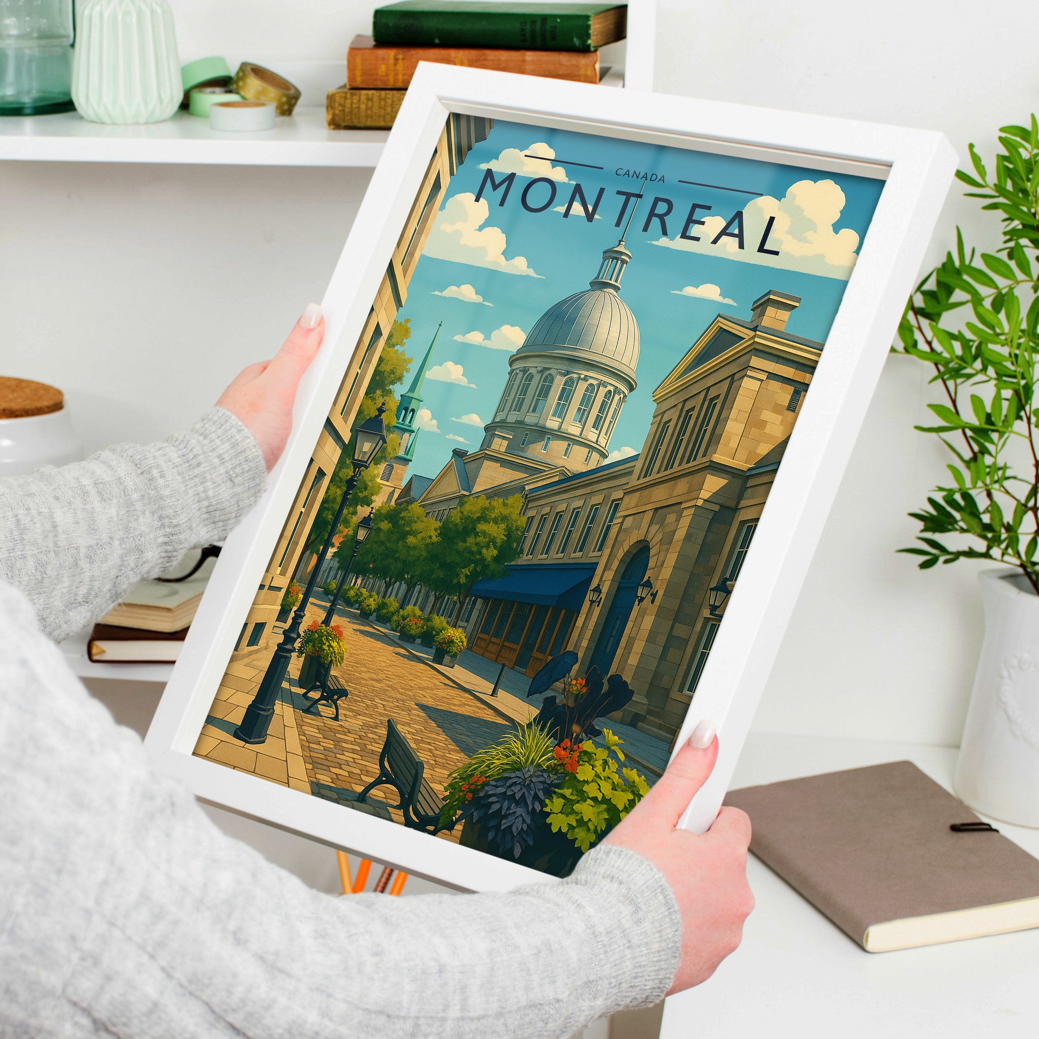 Montreal Travel Poster in a white frame, held to show scale