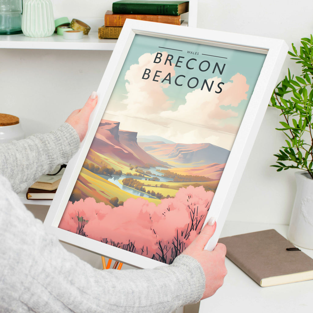 Brecon Beacons Travel Poster in a white frame, held to show scale