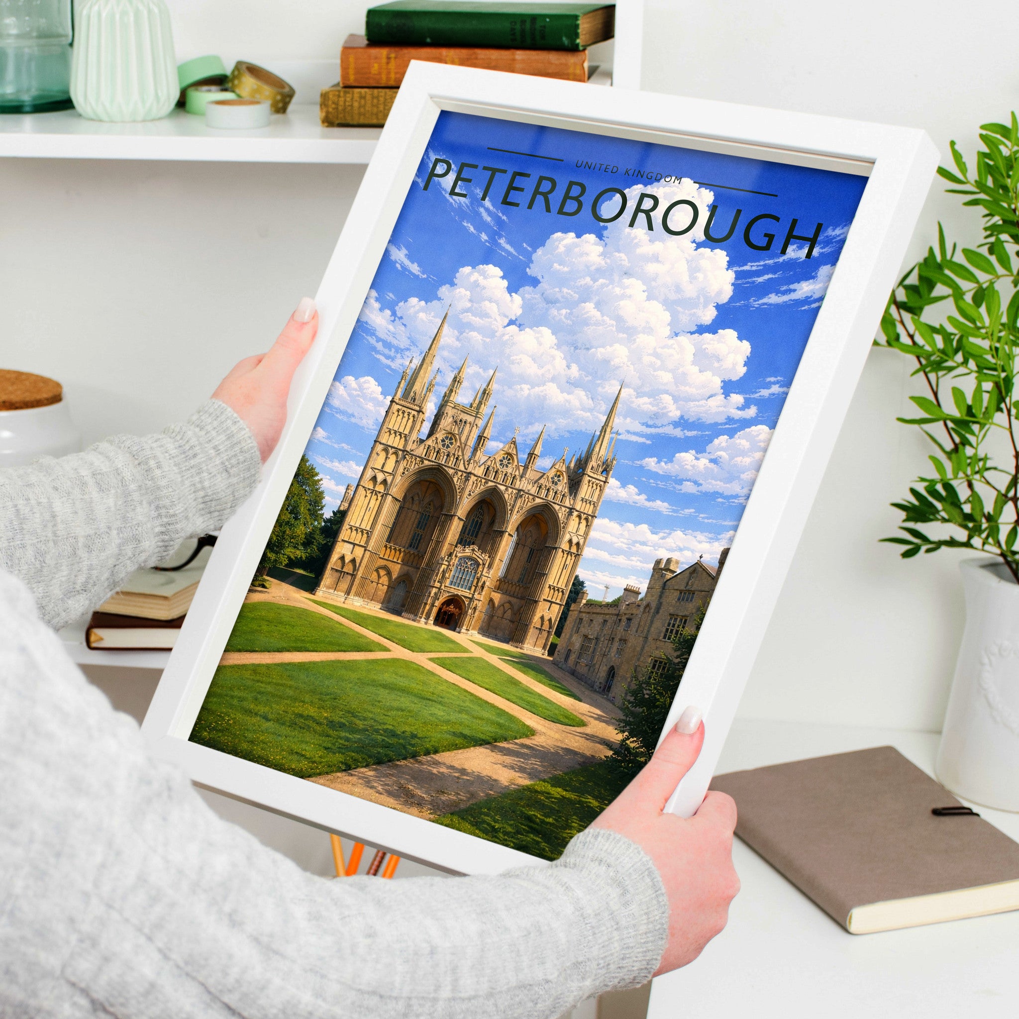 Peterborough #3 Travel Poster in a white frame, held to show scale