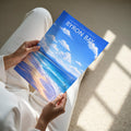 Byron Bay Travel Poster - A4 print held in hand