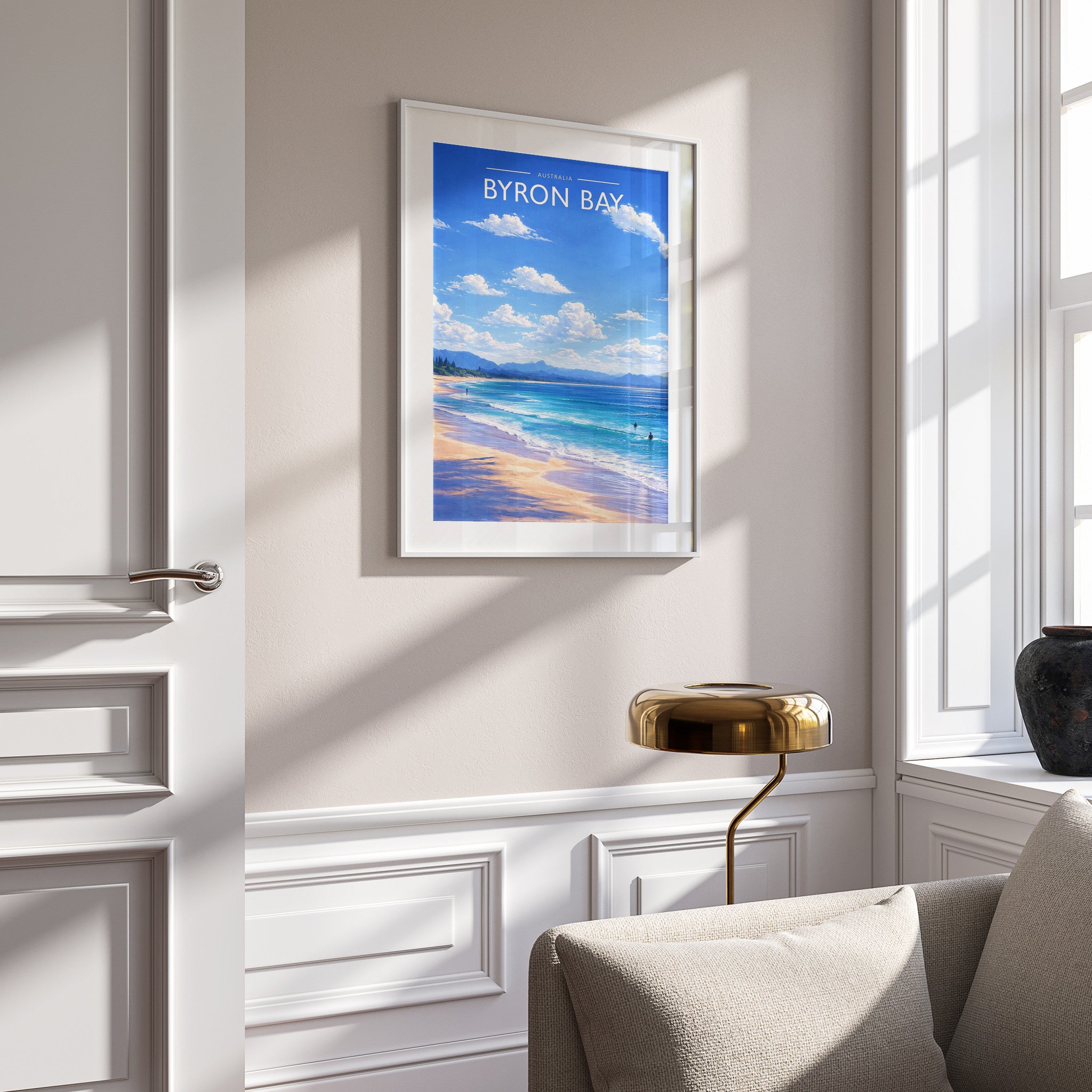 Byron Bay Travel Poster in a white frame on a panelled wall