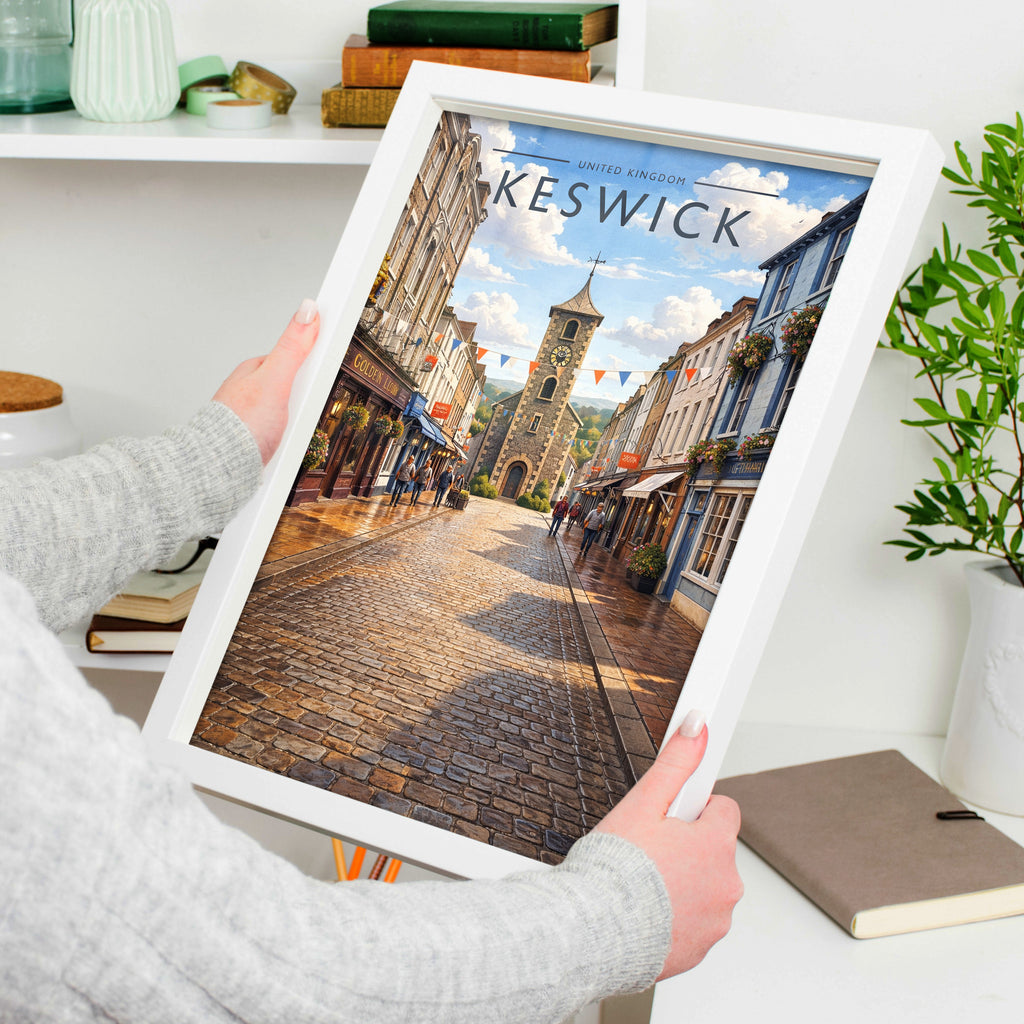 Keswick Travel Poster in a white frame, held to show scale