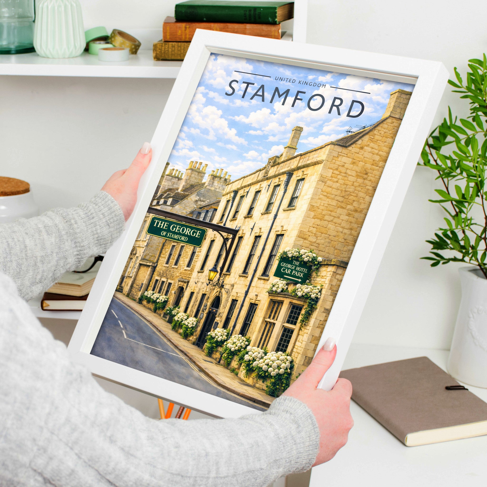 Stamford #7 Travel Poster in a white frame, held to show scale