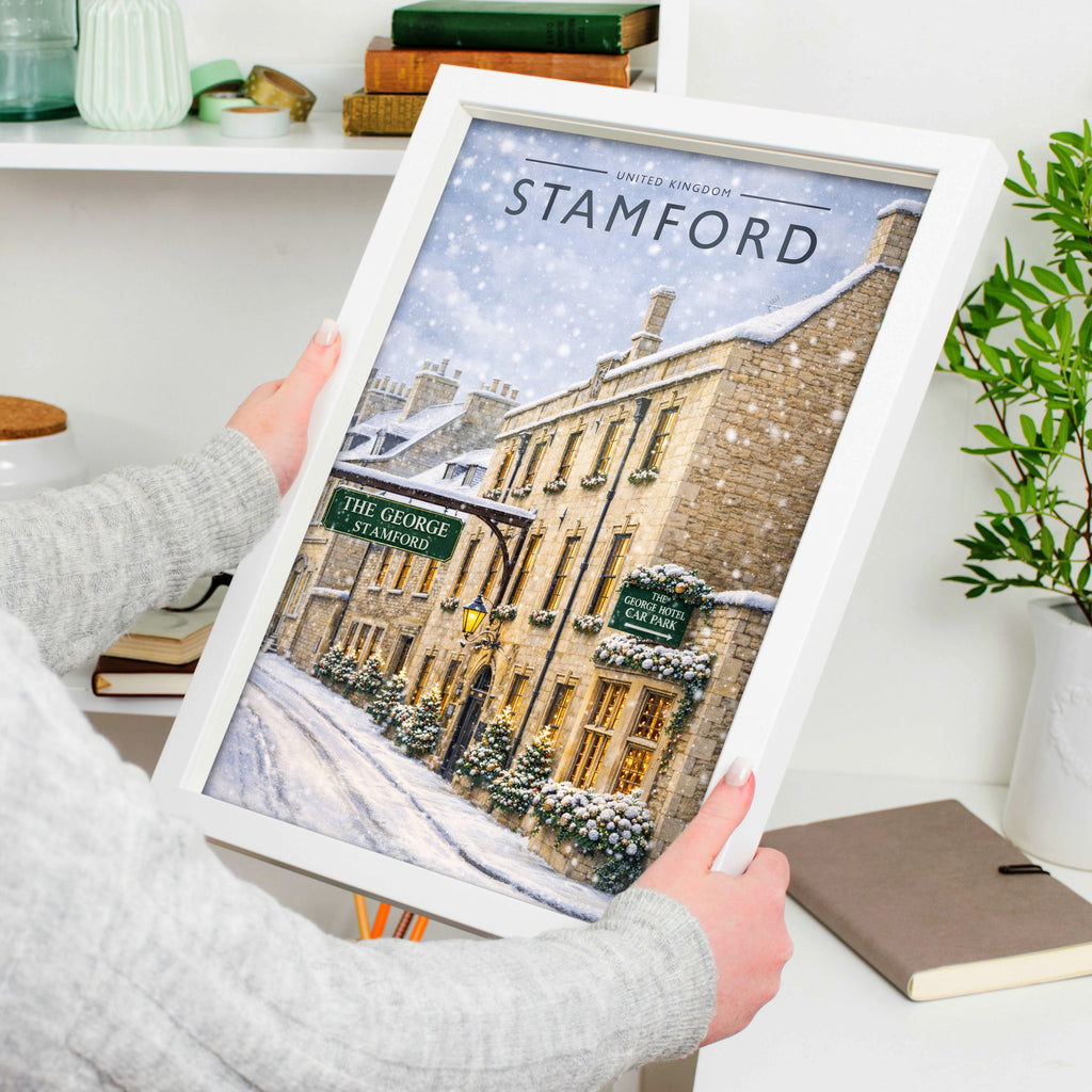 Stamford #8 Travel Poster in a white frame, held to show scale