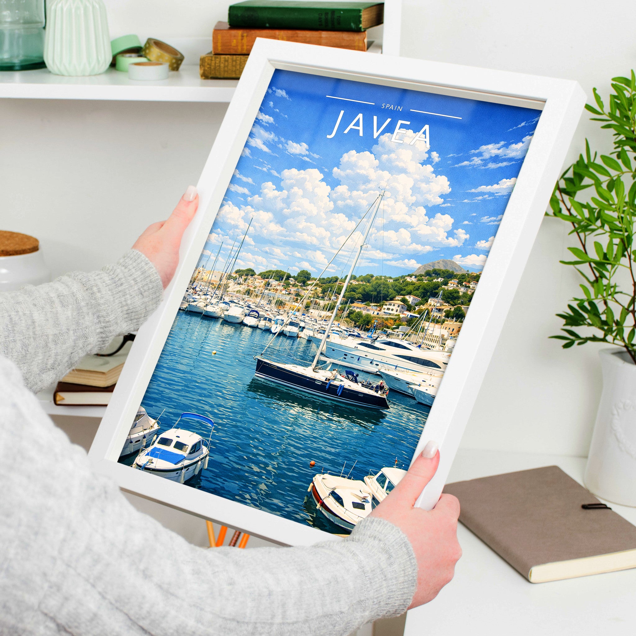 Javea #2 Travel Poster in a white frame, held to show scale