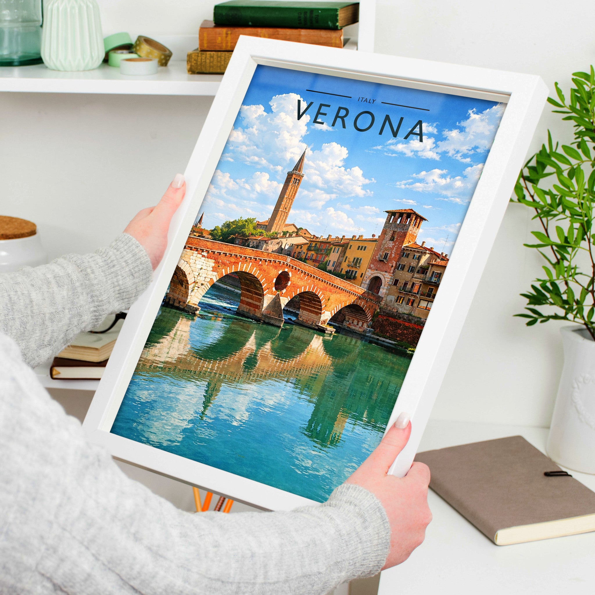 Verona Travel Poster in a white frame, held to show scale