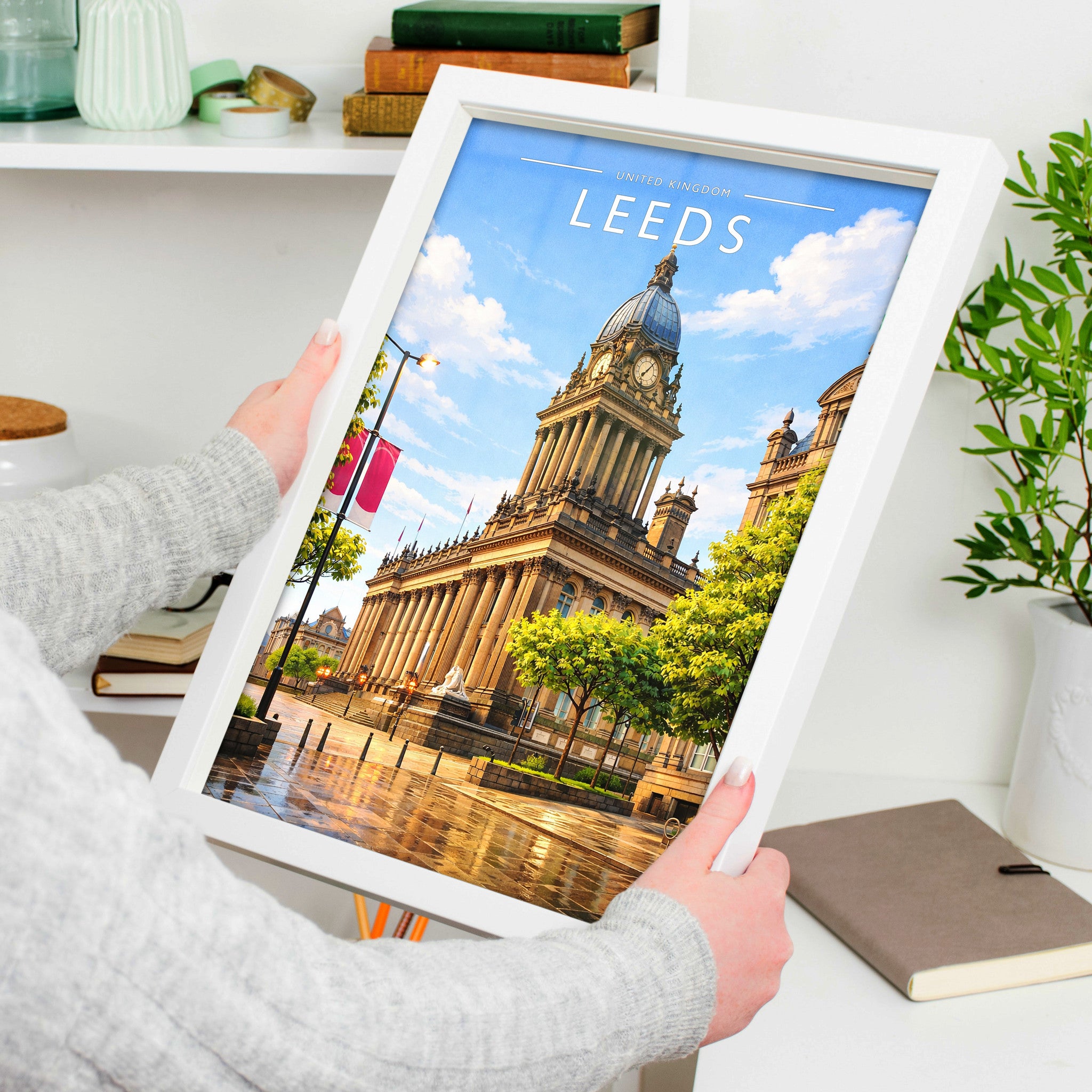 Leeds Travel Poster in a white frame, held to show scale