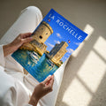 La Rochelle Travel Poster - A4 print held in hand