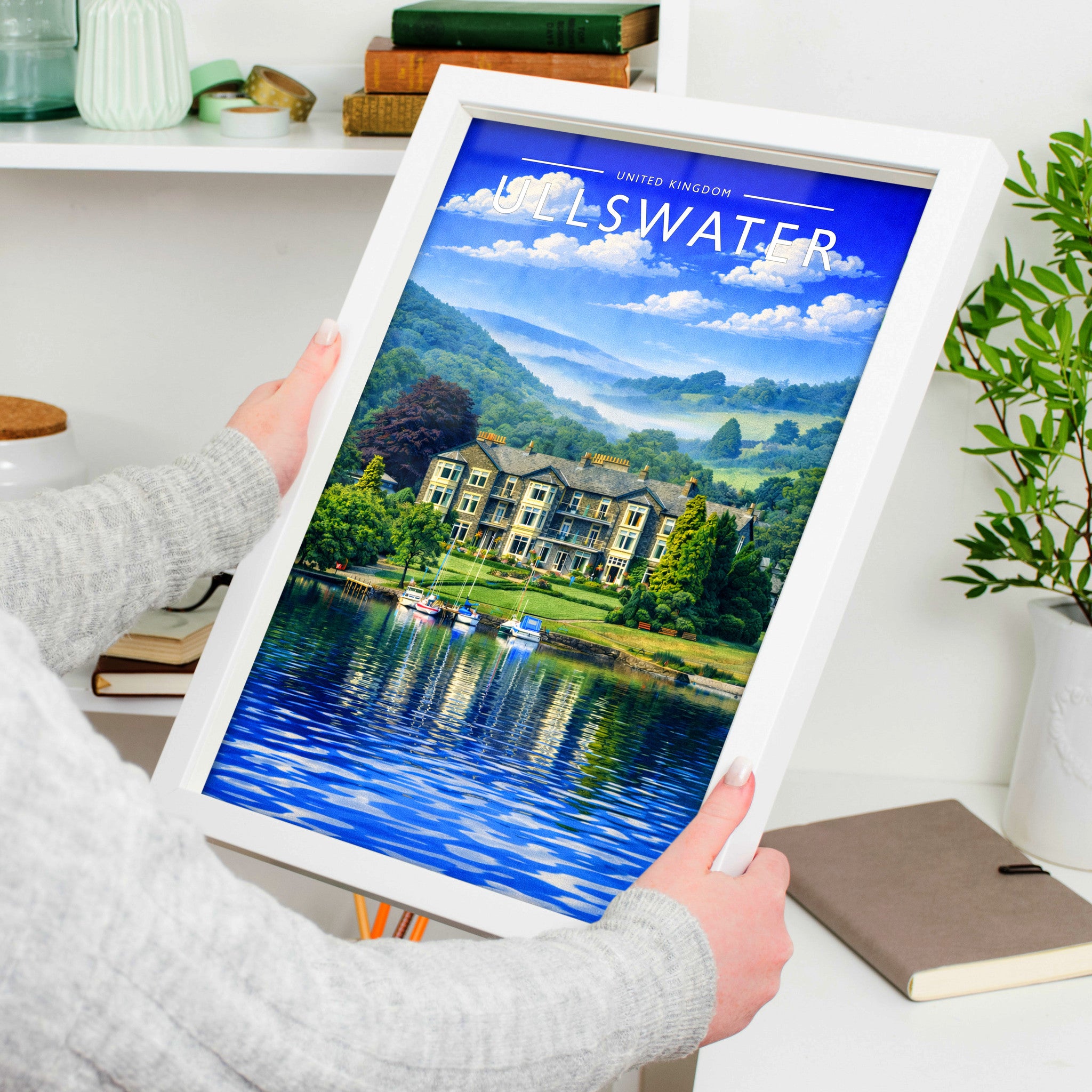 Ullswater Travel Poster in a white frame, held to show scale
