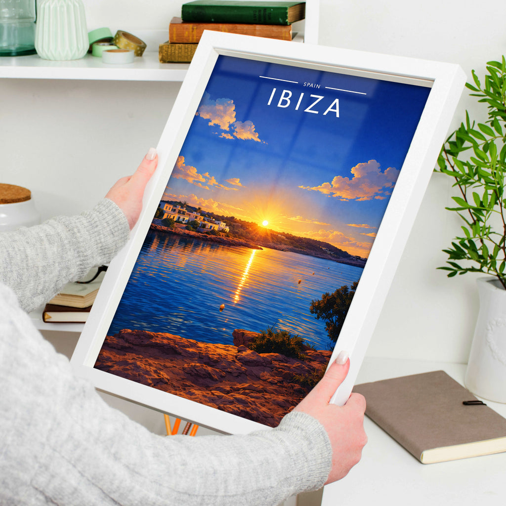 Ibiza #10 Travel Poster in a white frame, held to show scale