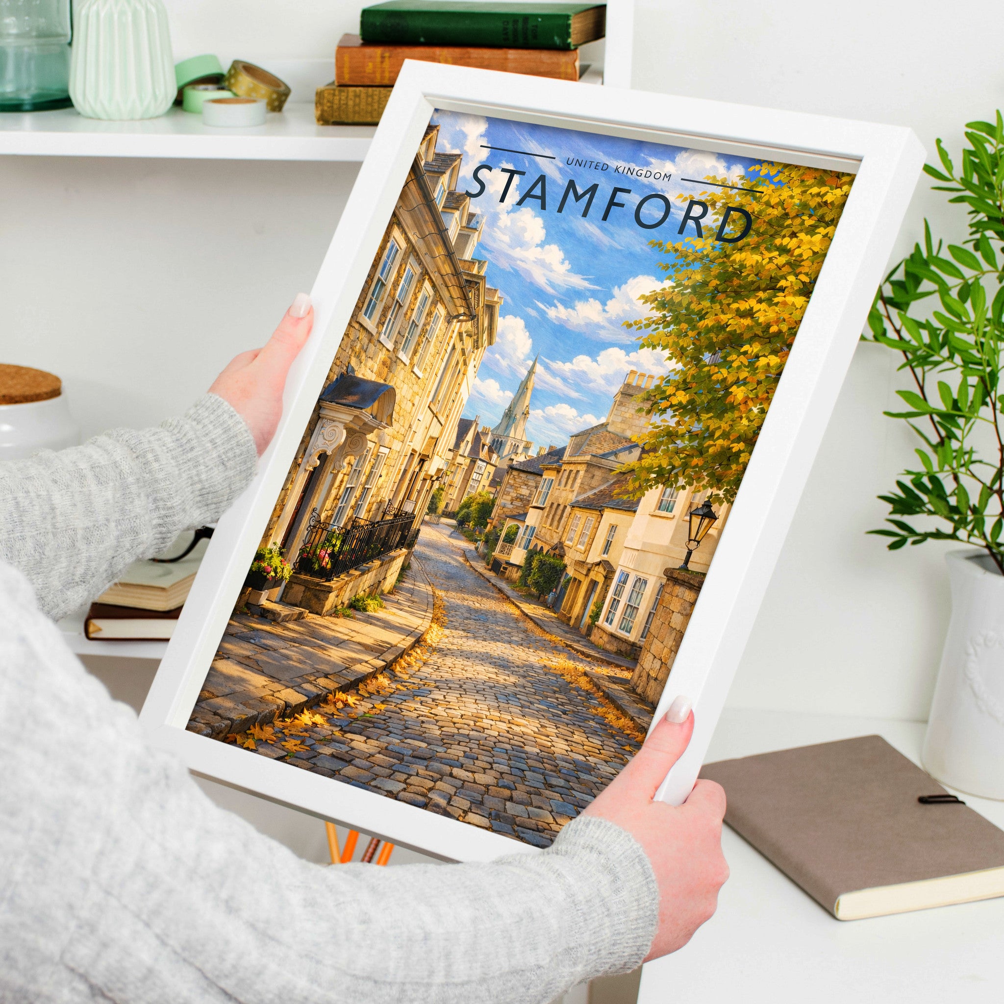Stamford #9 Travel Poster in a white frame, held to show scale