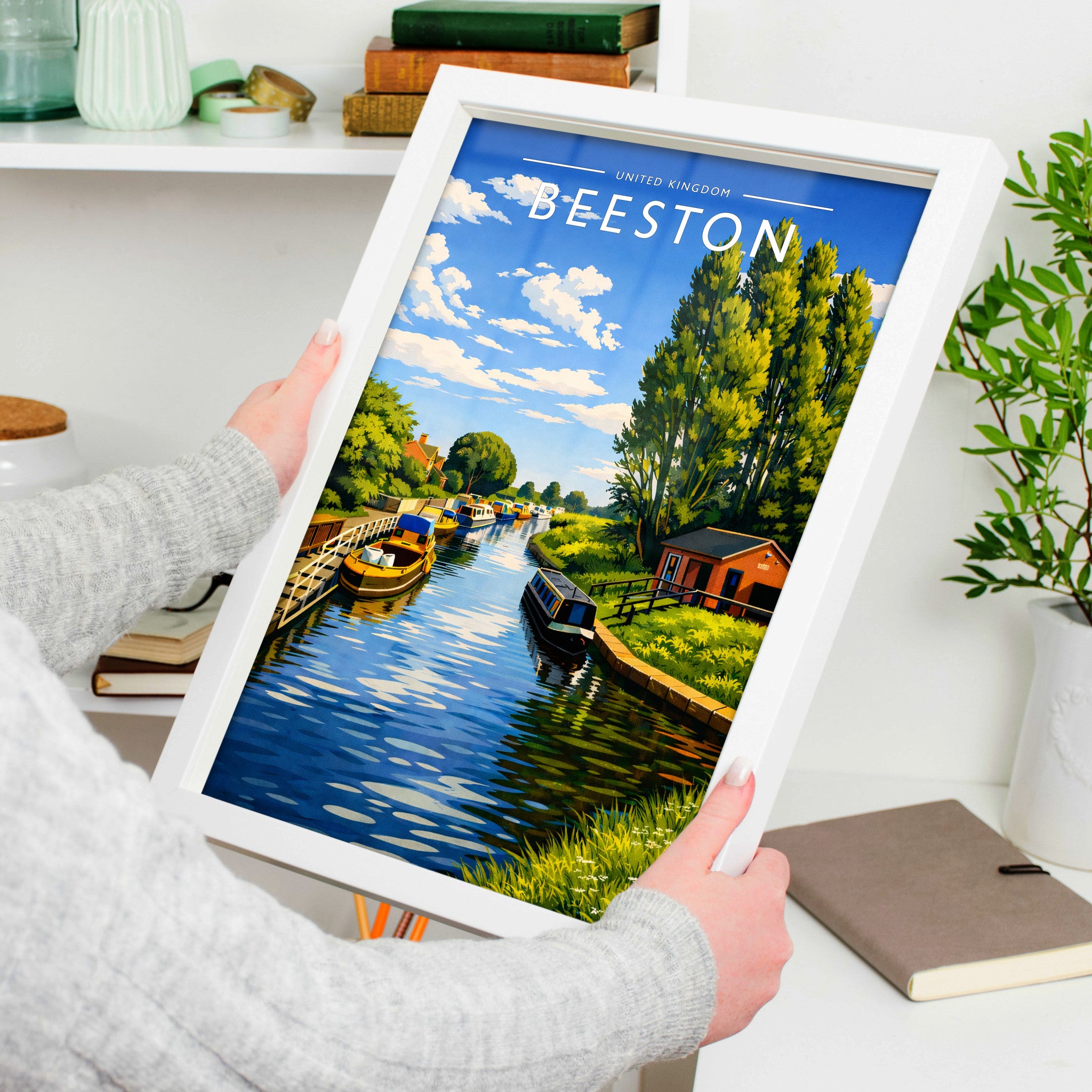 Beeston Travel Poster in a white frame, held to show scale