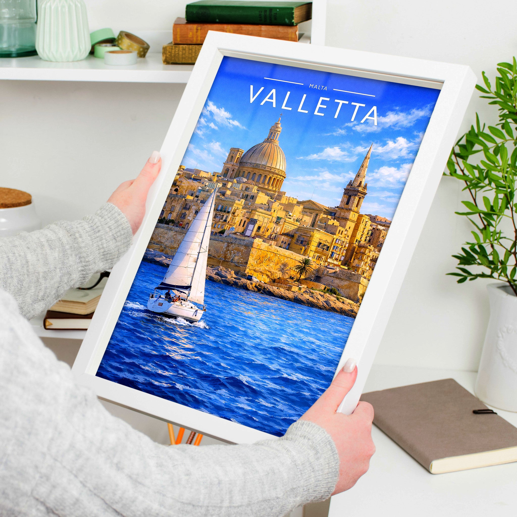 Valletta #2 Travel Poster in a white frame, held to show scale