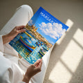 Marsaxlokk Travel Poster - A4 print held in hand