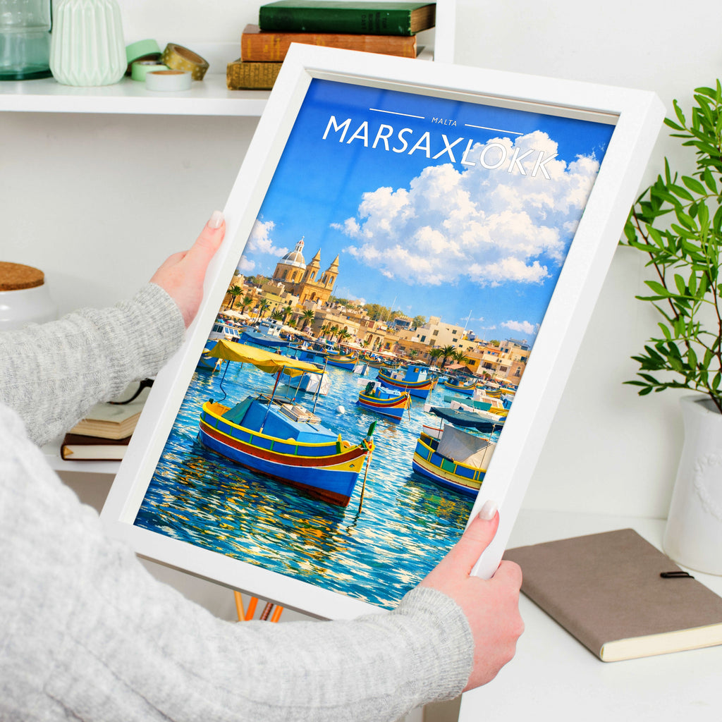 Marsaxlokk Travel Poster in a white frame, held to show scale