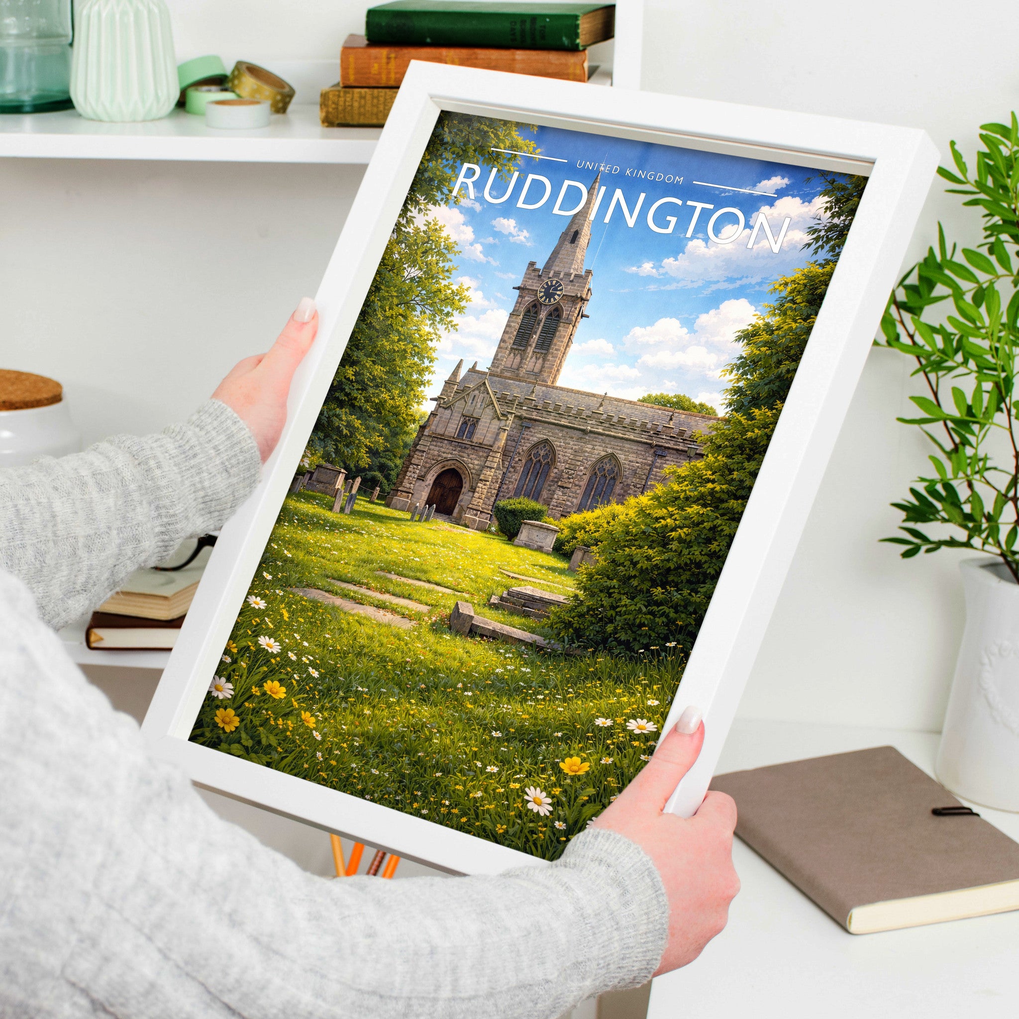 Ruddington Travel Poster in a white frame, held to show scale