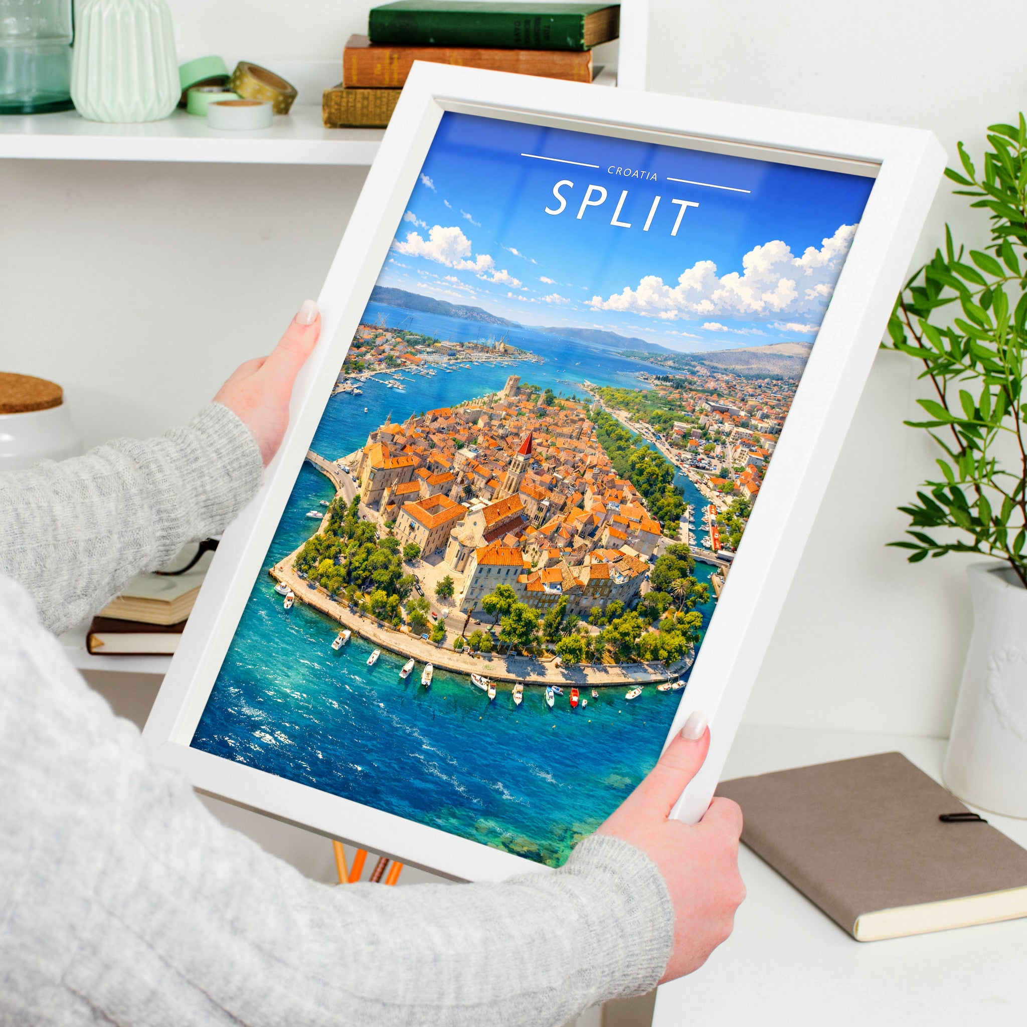 Split Travel Poster in a white frame, held to show scale