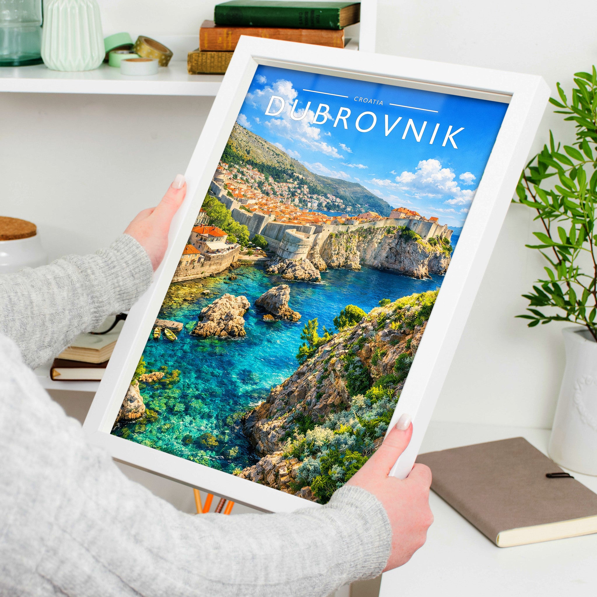 Dubrovnik Travel Poster in a white frame, held to show scale