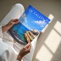 La Caletta Travel Poster - A4 print held in hand