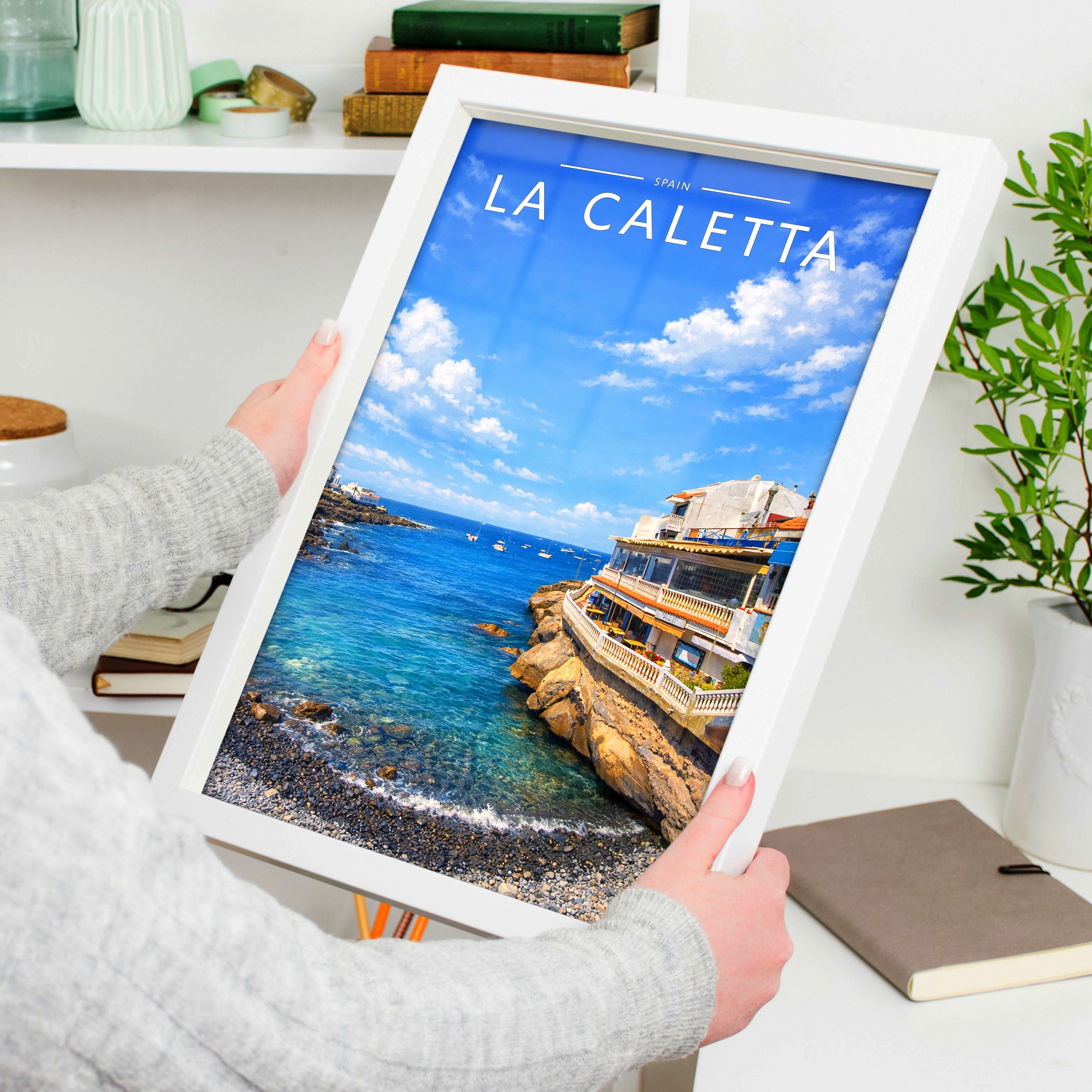 La Caletta Travel Poster held in a white frame