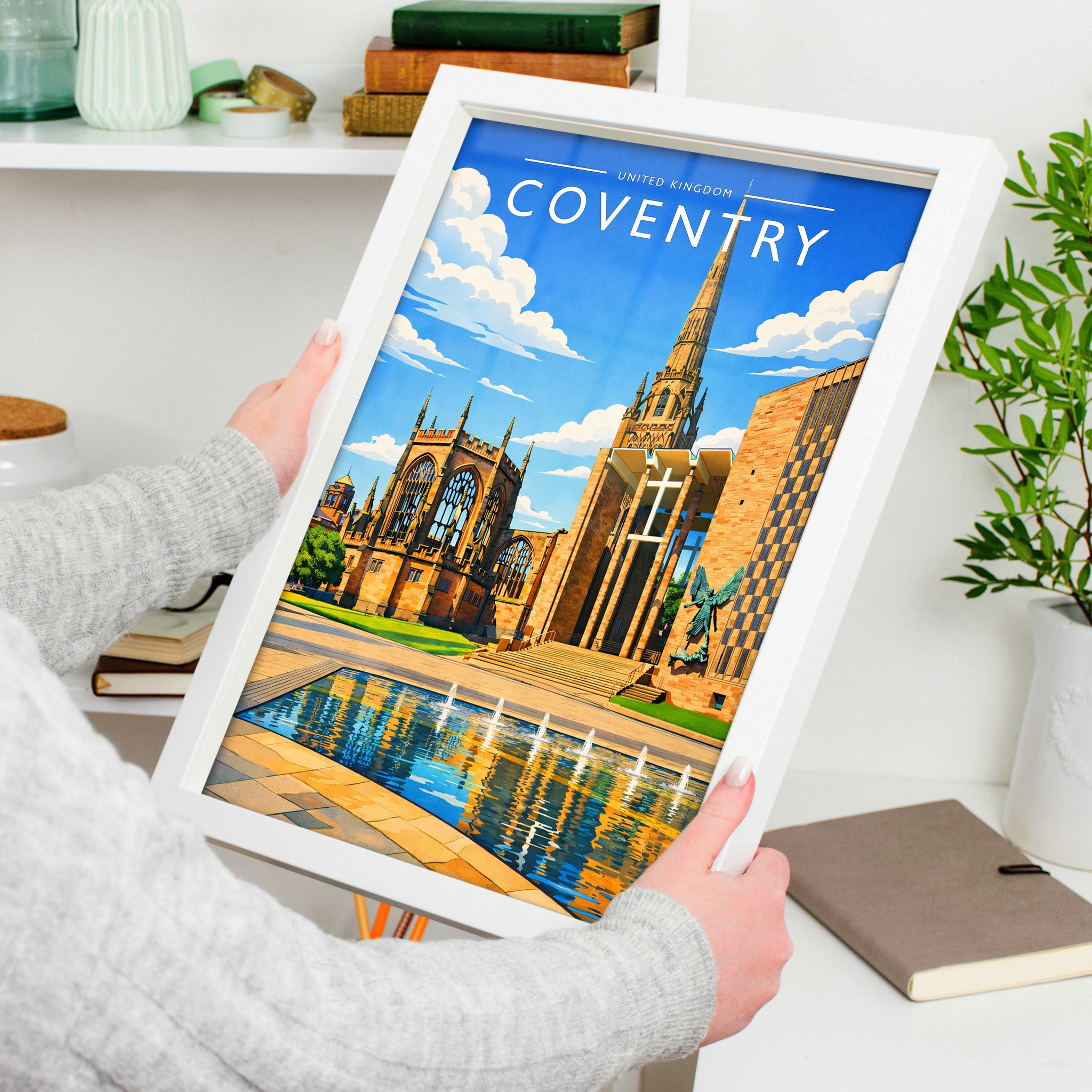 Coventry Travel Poster in a white frame, held to show scale