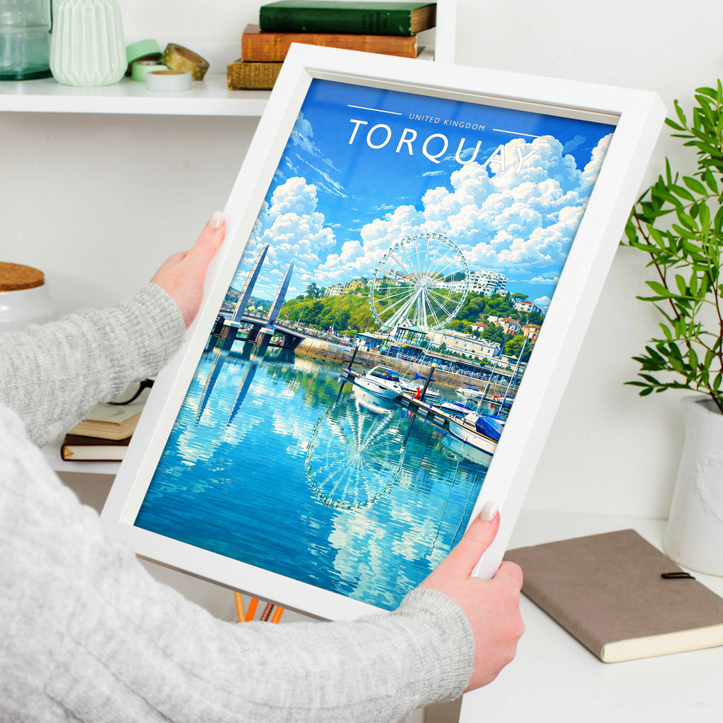 Torquay Travel Poster in a white frame, held to show scale