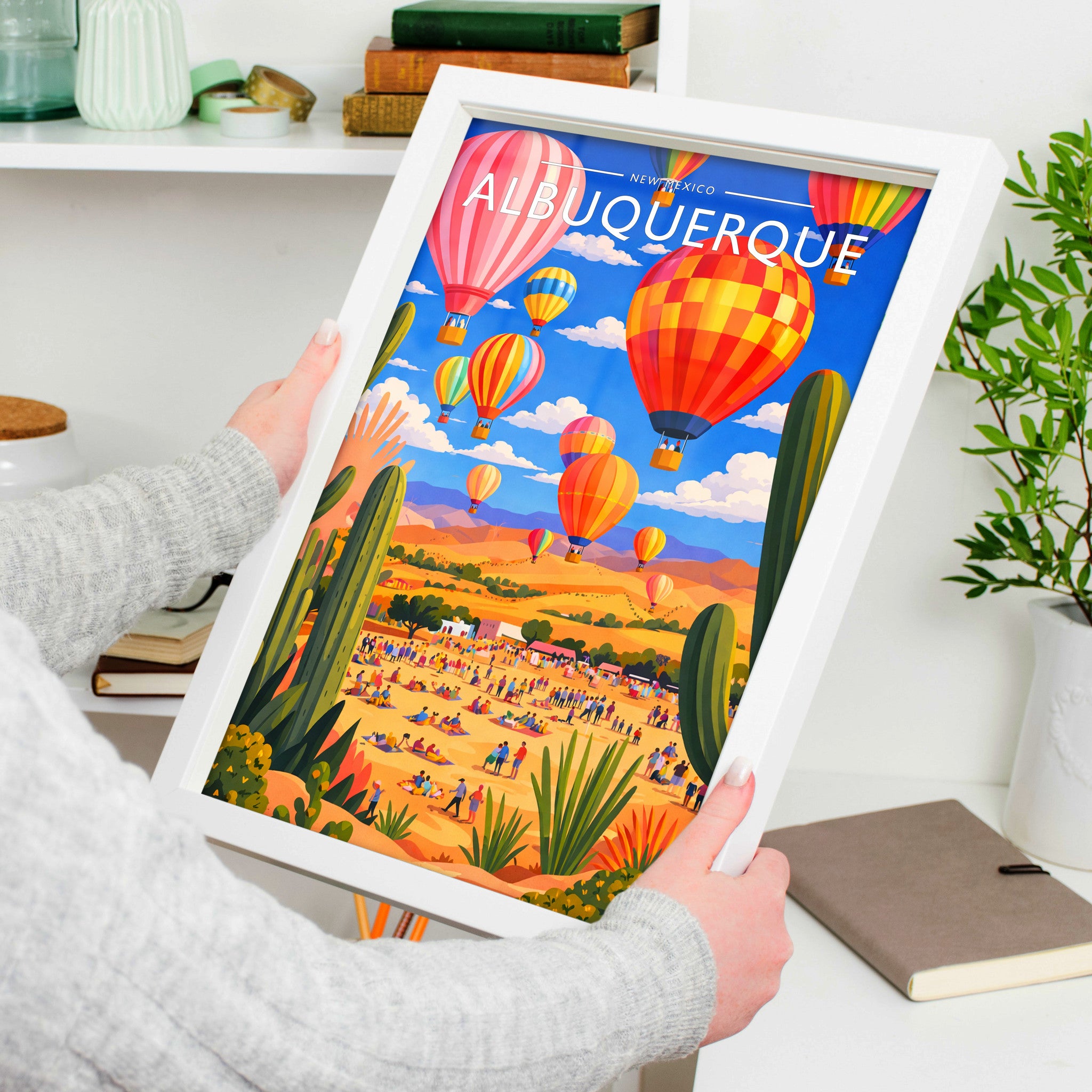 Albuquerque Travel Poster in a white frame, held to show scale