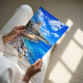 Torrevieja Travel Poster - A4 print held in hand