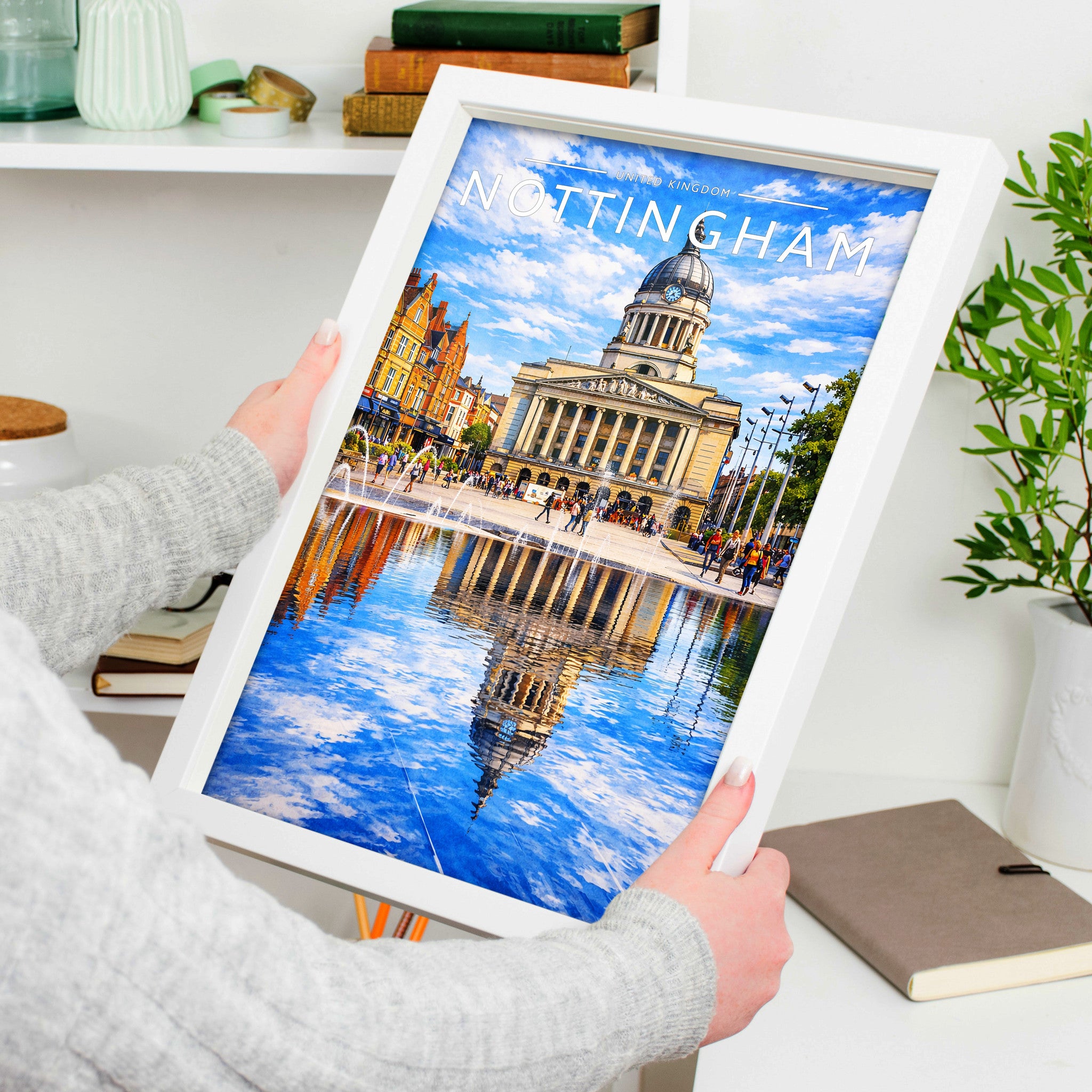 Nottingham #2 Travel Poster in a white frame, held to show scale