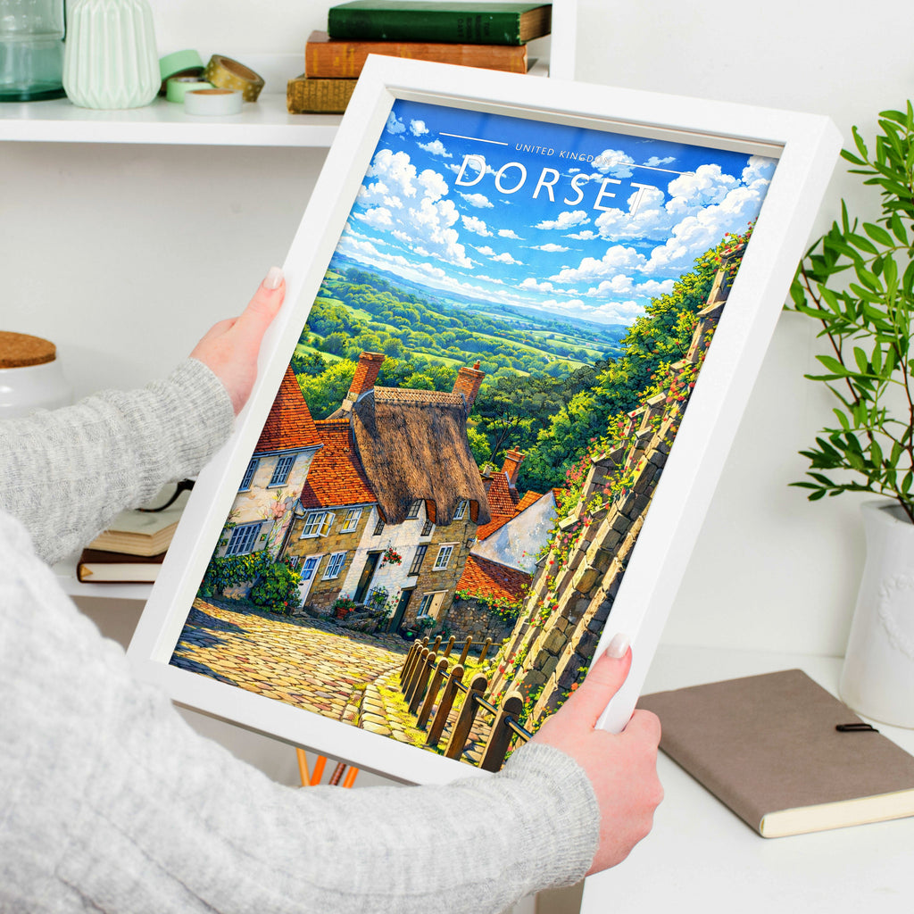 Dorset Travel Poster in a white frame, held to show scale
