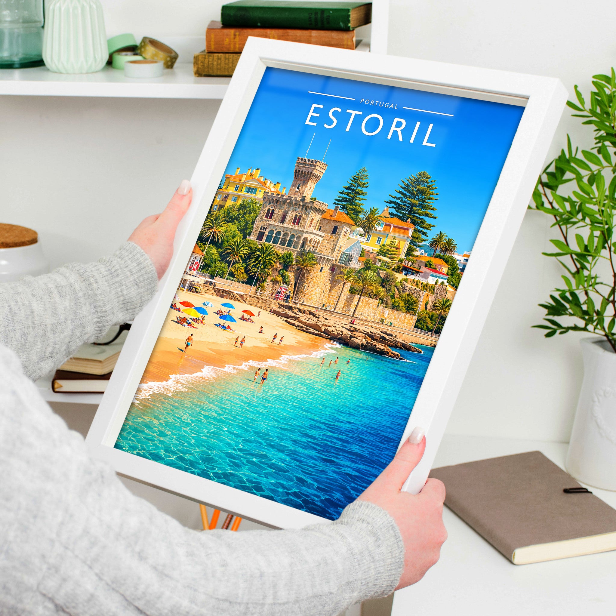 Estoril Travel Poster in a white frame, held to show scale