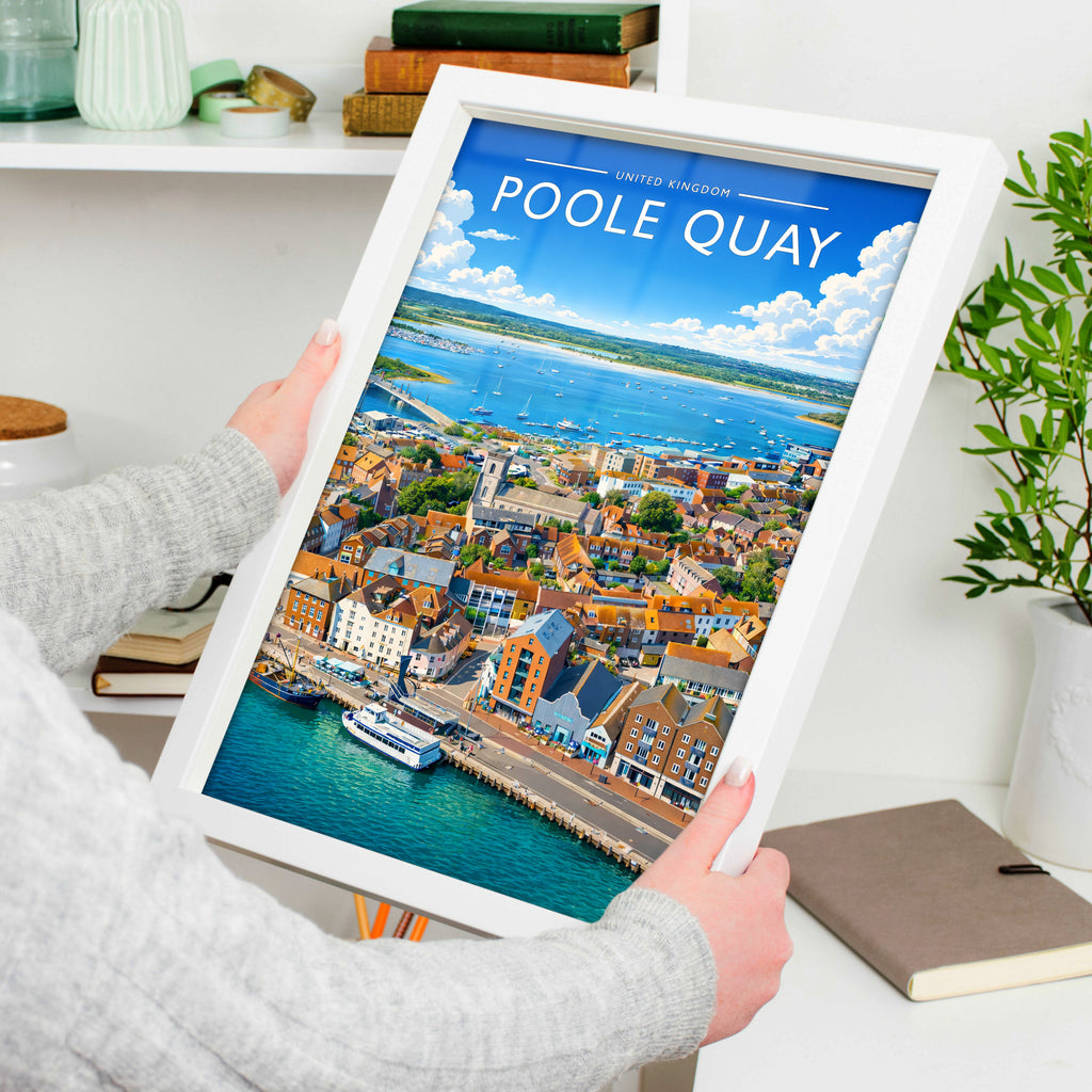 Poole Quay Travel Poster in a white frame, held to show scale