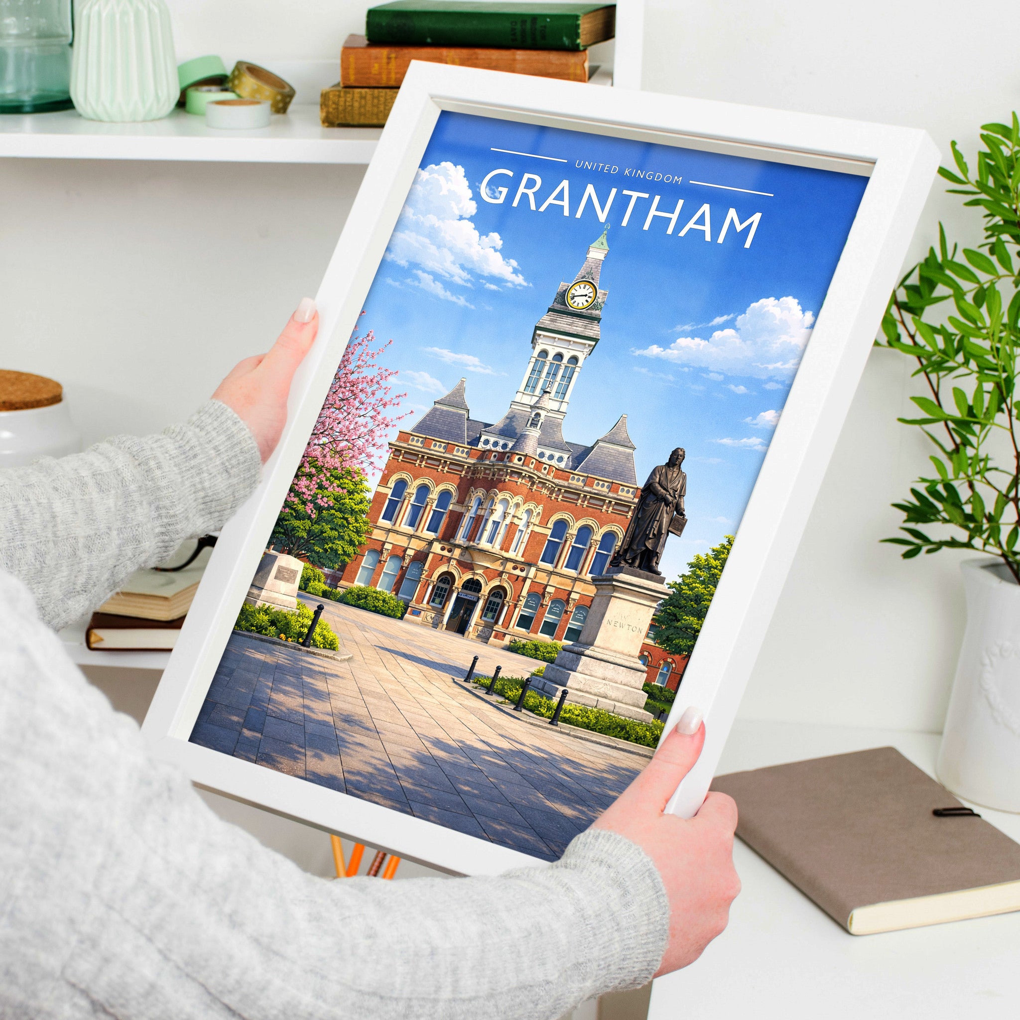 Grantham Travel Poster in a white frame, held to show scale