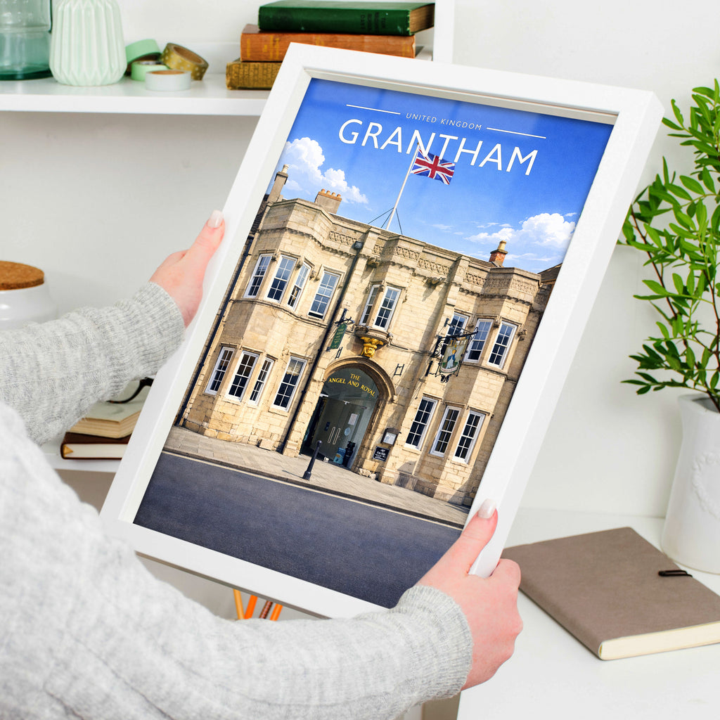 Grantham #2 Travel Poster in a white frame, held to show scale