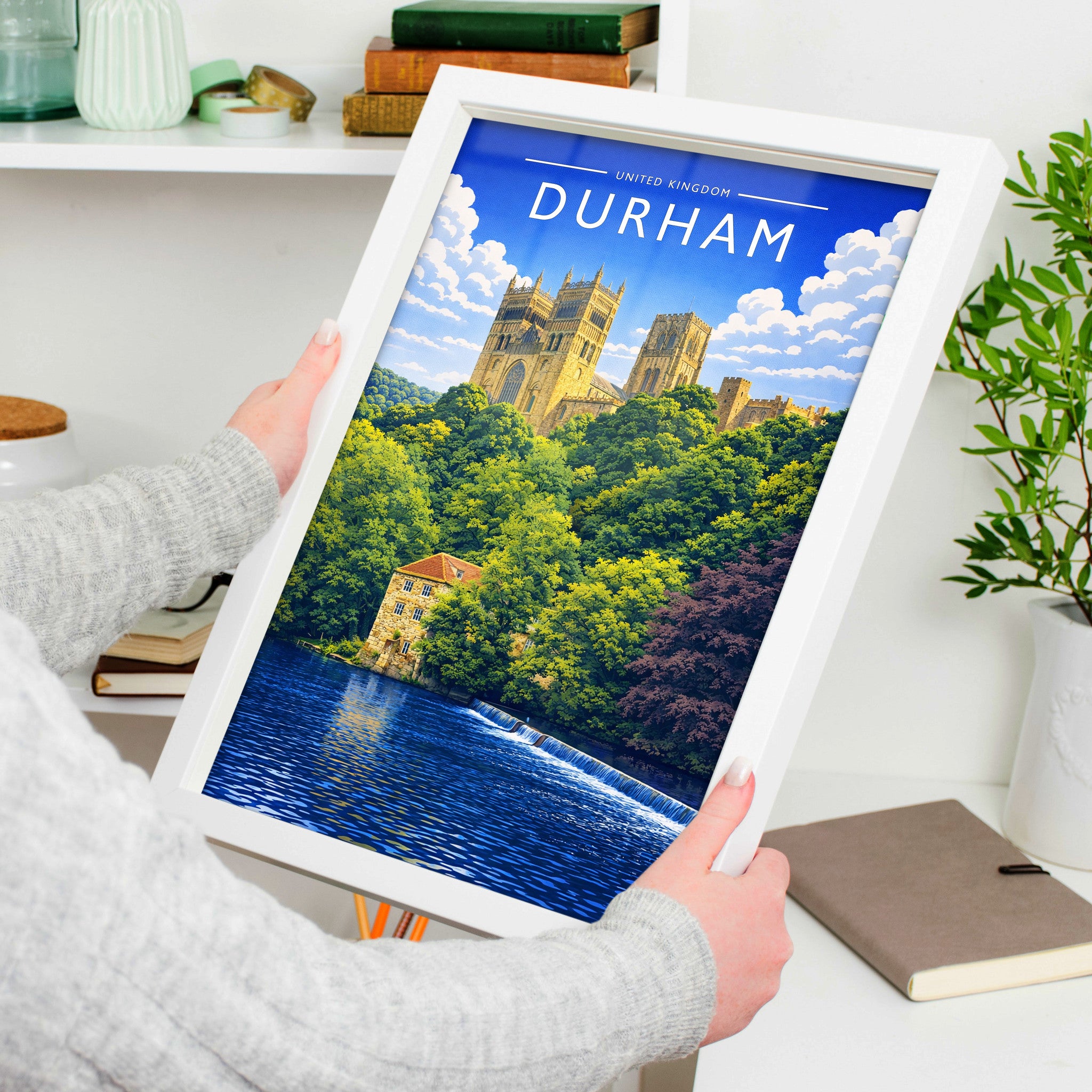 Durham Travel Poster in a white frame, held to show scale